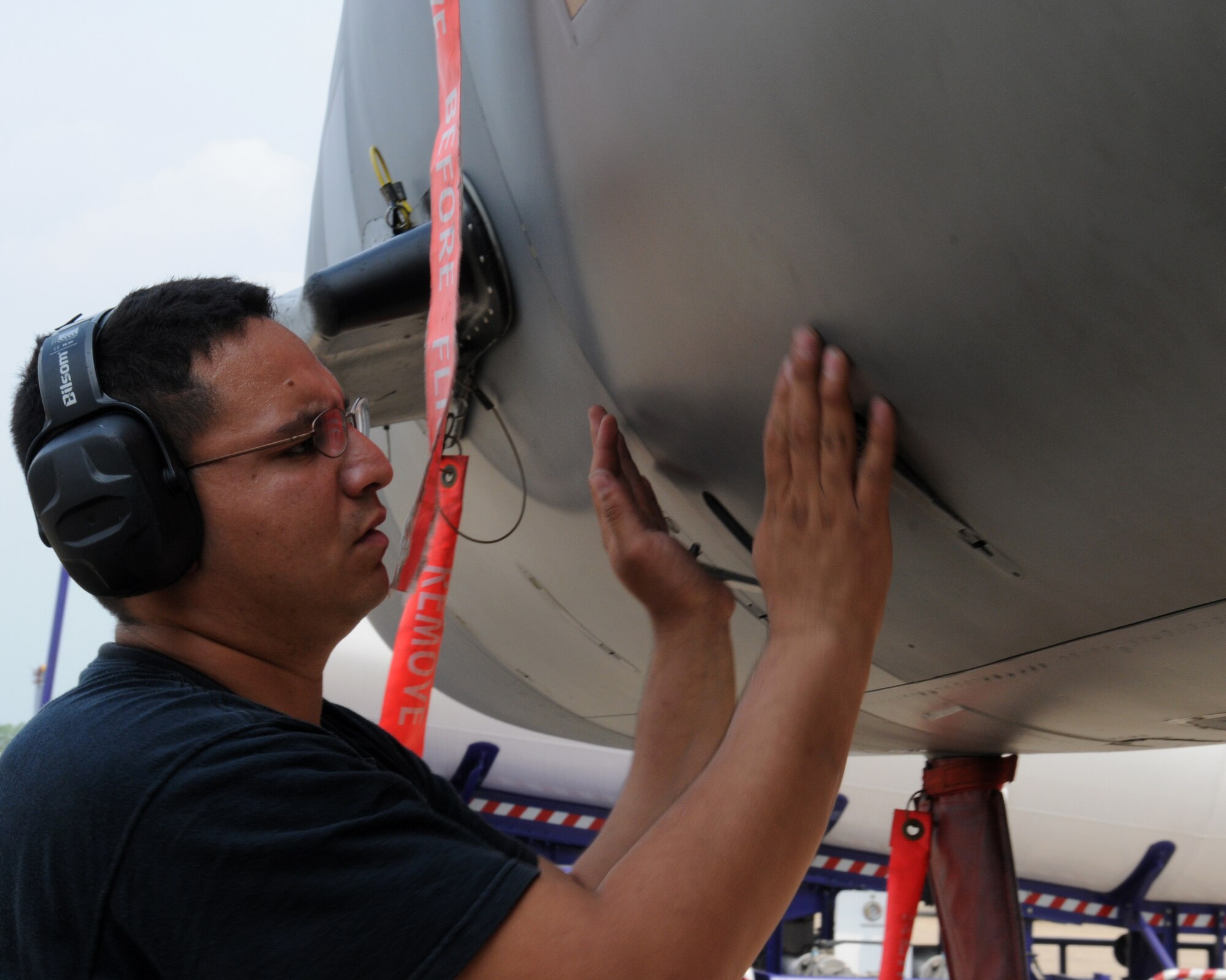 U.S. Air Force Staff Sgt. Rafael Soriano, from the 18th Aircraft Maintenance Squadron, Kadena Air Base, Japan, conducts a post-flight check on one of Kadena's F-15's on the flight line at Korat Royal Air Force Base, Thailand during Cope Tiger 2009 on March 10.

Cope Tiger 2009 is an annual exercise to improve combat readiness and combined and joint interoperability of U.S., Thai and Singaporean forces while enhancing regional security and providing humanitarian support.
(U.S. Air Force Photo/Staff Sgt. Angelique Perez) 