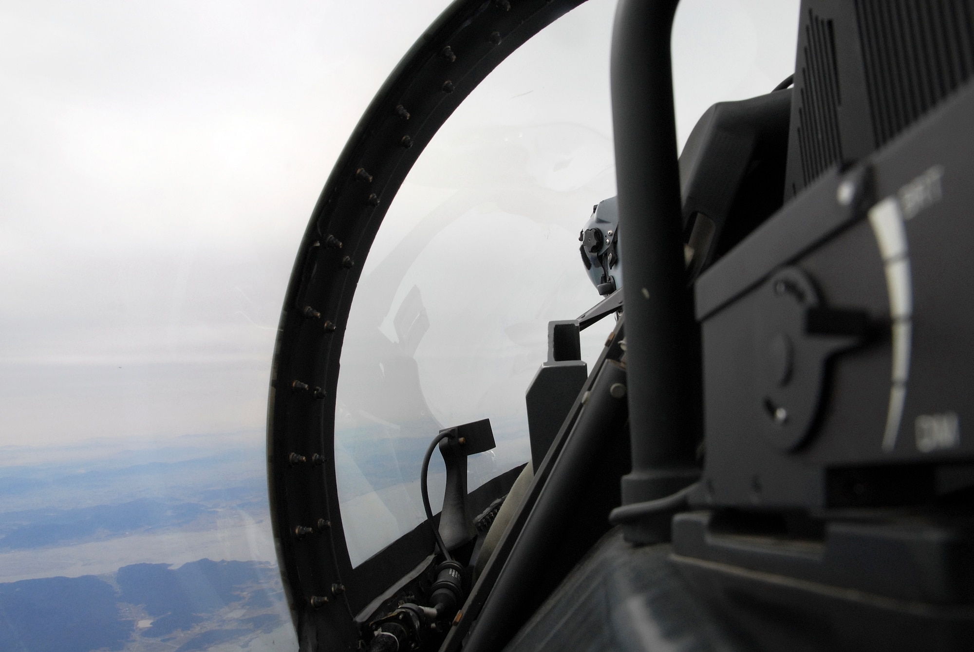 Captain William MaClin, 80th Fighter Squadron, surveys the horizon for hostile aircraft whie flying in the Buddy Wing program over Kunsan Air Base, Republic of Korea, March 11 2009. Buddy Wing is an operation designed to increase United States Air Force and ROKAF interoperability. (U.S. Air Force Photo by SSgt Jason Colbert)
