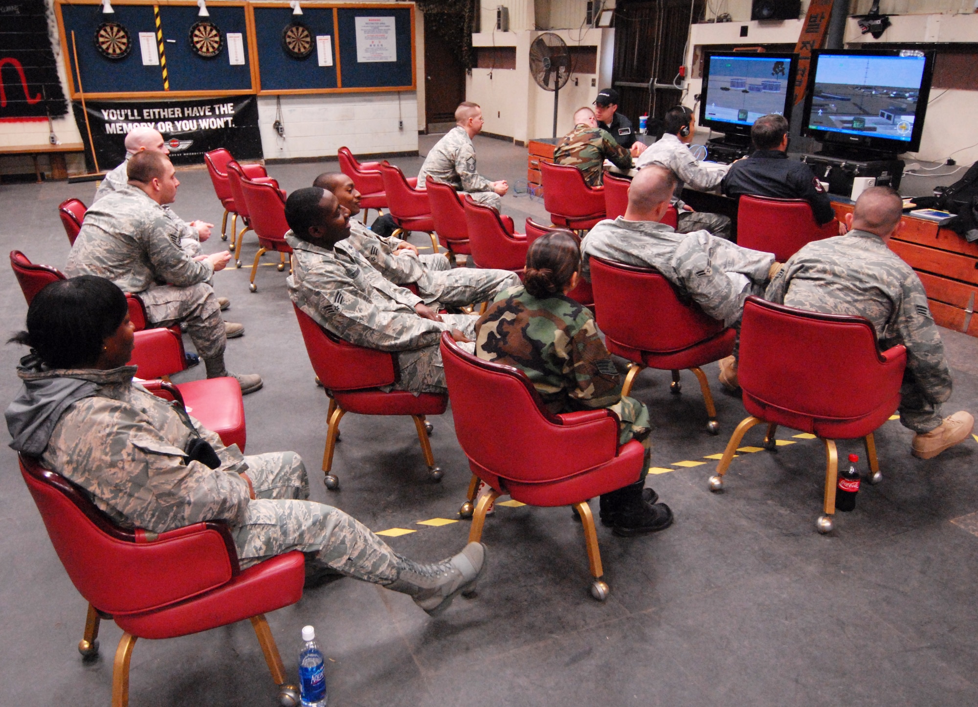 Instructors from Hulburt Field, Florida train Airmen on the AC-130 gunship simulator at Kunsan Air Base, Republic of Korea, March 10, 2009. (U.S. Air Force Photo/Senior Airman Gustavo Gonzalez)