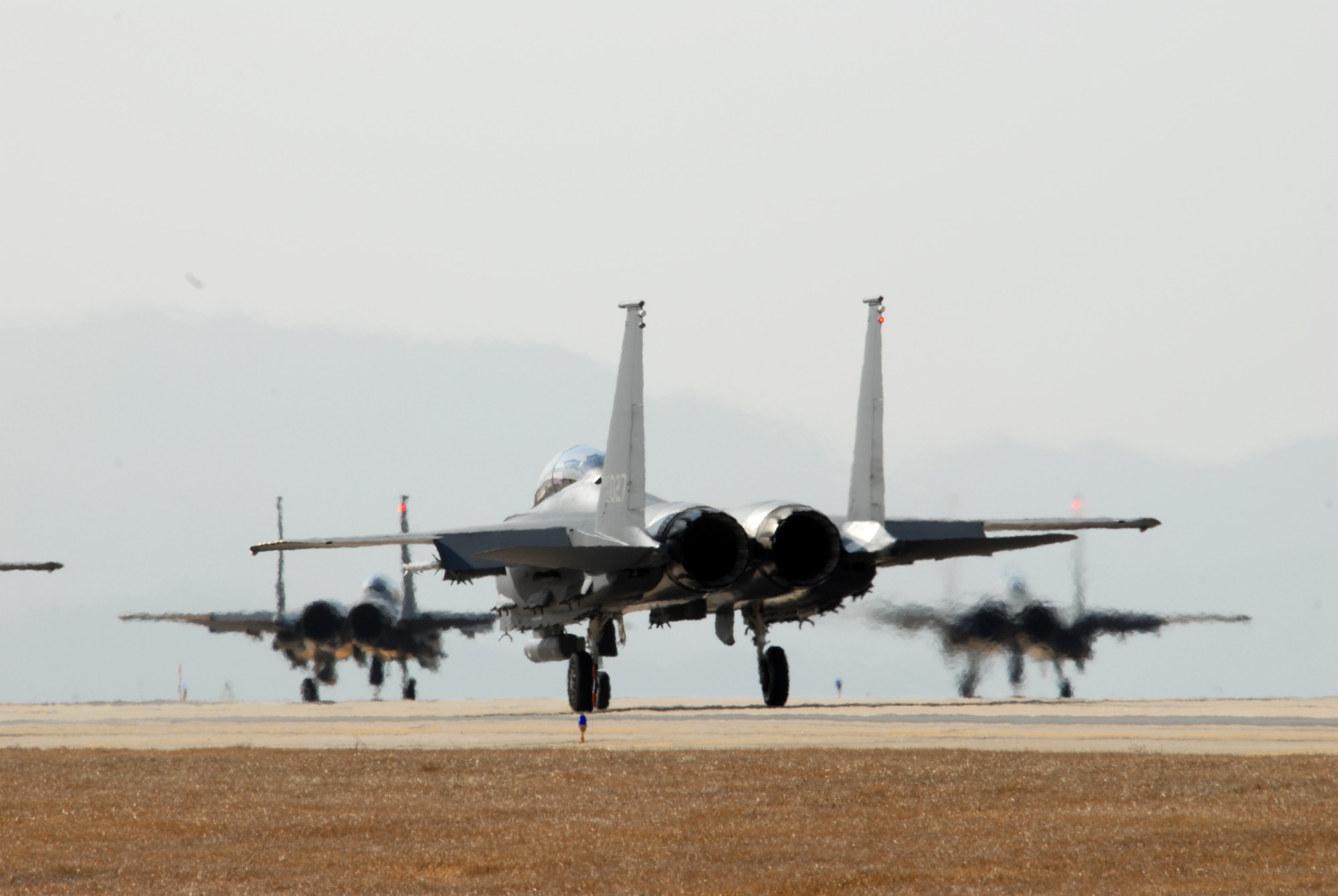 Republic of Korea Air Force F-15K Slam Eagles from the 11th Tactical Fighter Wing taxi down the flightline prior to take off while participating in the "Buddy Wing" exercise at Kunsan Air Base, Republic of Korea, March 10, 2009. The 8th Fighter Wing and 11th TFW are participating to practice and enhance combined air operations.(US Air Force Photo By: Senior Airman Angela Ruiz)