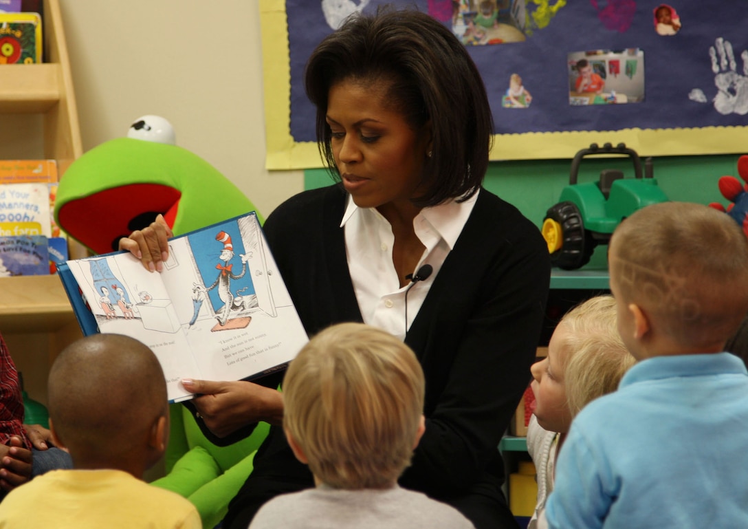 First lady Michelle Obama reads "The Cat in the Hat" to children at Prager Child Development Center at Fort Bragg, N.C., March 12, 2009. The first lady spoke with soldiers and family members as part of her initiative to care for military families. U.S. Army photo by Reginald Rogers