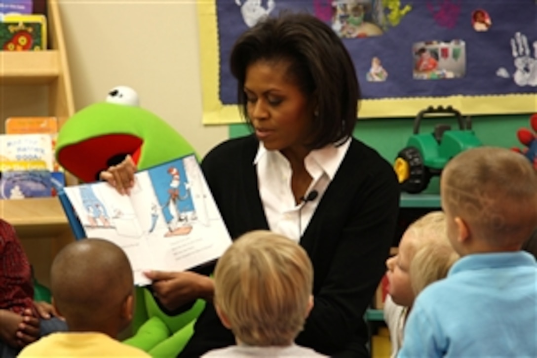 First lady Michelle Obama reads "The Cat in the Hat" to children in Ms. Mattie's class at Prager Child Development Center March 12, 2009, during her visit to Fort Bragg, N.C. The first lady spoke with soldiers and family members as part of her initiative to care for military families. 