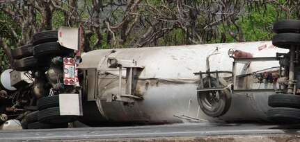 SOTO CANO AIR BASE, Honduras - A leak in an overturned fuel tanker caused the closure of C.A. 5, approximately 8 kilometers north of the base Friday for more than 24 hours.  The truck overturned after hitting a horse on the road around 8 a.m.  Joint Task Force-Bravo firefighters and medics responded to provide assistance to the Comayagua fire department.  (U.S. Air Force photo/Tech. Sgt. Rebecca Danét)  