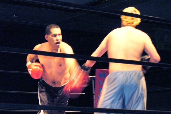 ANCHORAGE, Alaska -- Staff Sgt. Jorge Mendoza, 477th Force Support Squadron, throws a punch during his debut fight at the Anchorage Thursday Night Fights Event March 12.  The 477 FSS is assigned to the 477th Fighter Group.  The 477 FG is a Classic Associate Air Force Reserve unit responsible for recruiting, training, developing and retaining unrivaled Citizen Airmen. (Courtesy Photo)