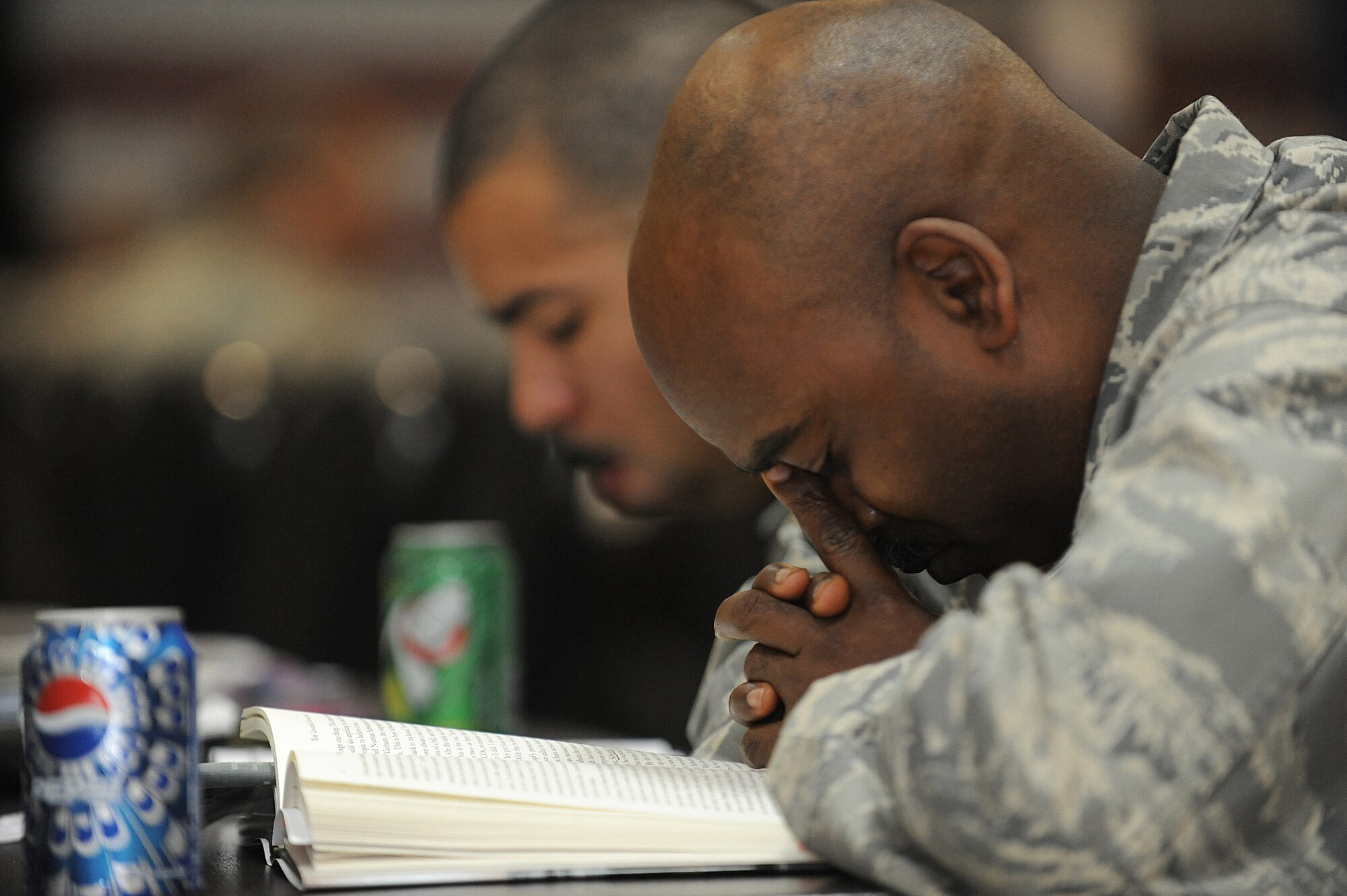 JOINT BASE BALAD, Iraq -- Chaplain (Capt.) Dwayne Jones, 3rd Sustainment Command, takes a moment to pray during a National Prayer Luncheon here March 10. The National Prayer Breakfast or Luncheon was established in 1953 by President Dwight D. Eisenhower to recognize the moral and religious values upon which the nation is founded. Jones is deployed from Mountain Home Air Force Base, Idaho, and is a native of Live Oak, Fla. (U.S. Air Force photo/Senior Airman Elizabeth Rissmiller)