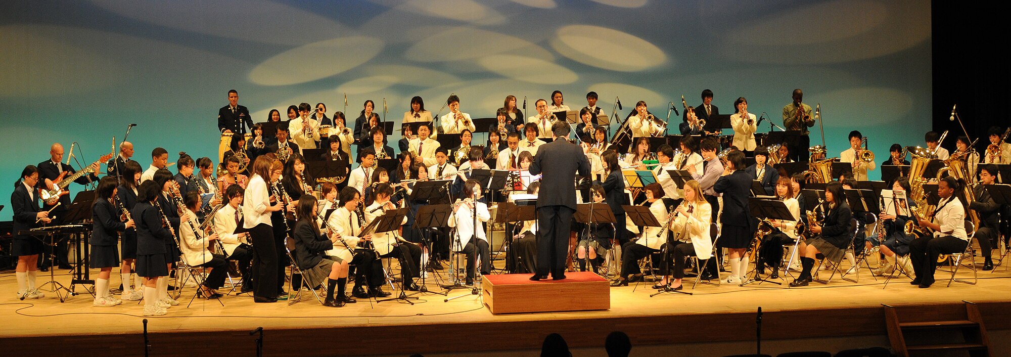 FUSSA CITY, Japan -- Musicians from four local bands perform together March 15 at the Japan-U.S. Joint Concert, "Music Across the Border." The concert took place at Fussa Citizens' Hall and about 850 Japanese and American guests attended the concert. (U.S. Air Force photo/Airman Sean Martin)