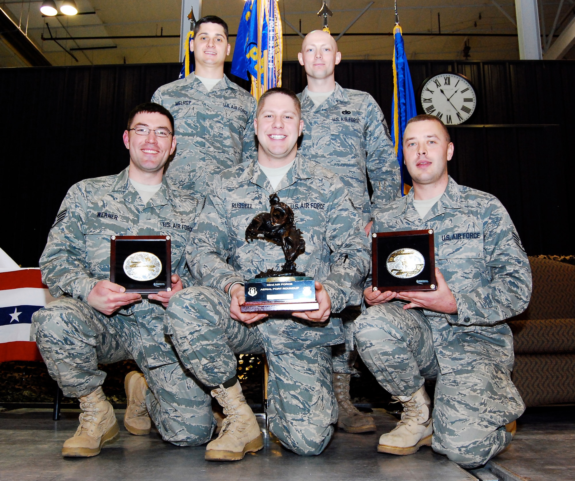 Members of the 27th Aerial Port Squadron beam with pride holding their bucking bronco Overall Winner trophy and their In-Transit Visibility Winner belt buckle March 15 at the first 22nd Air Force Aerial Port ROUNDUP. Members of the team include, from left, Staff Sgt. Jesse Werner, Staff Sgt. Justin Melroy, Staff Sgt. Matthew Russell, Master Sgt. Damion Kosmosky and Senior Airman Troy Olsen. This group of traditional reservists practiced since November during unit training assemblies and additional weekends to prepare for the competition at Dobbins Air Reserve Base, Ga. Four of the five members will deploy to Southwest Asia in the coming months. (U.S. Air Force photo/Staff Sgt. Steve Lewis)