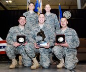 Members of the 27th Aerial Port Squadron beam with pride holding their bucking bronco Overall Winner trophy and their In-Transit Visibility Winner belt buckle March 15 at the first 22nd Air Force Aerial Port ROUNDUP. Members of the team include, from left, Staff Sgt. Jesse Werner, Staff Sgt. Justin Melroy, Staff Sgt. Matthew Russell, Master Sgt. Damion Kosmosky and Senior Airman Troy Olsen. This group of traditional reservists practiced since November during unit training assemblies and additional weekends to prepare for the competition at Dobbins Air Reserve Base, Ga. Four of the five members will deploy to Southwest Asia in the coming months. (U.S. Air Force photo/Staff Sgt. Steve Lewis)