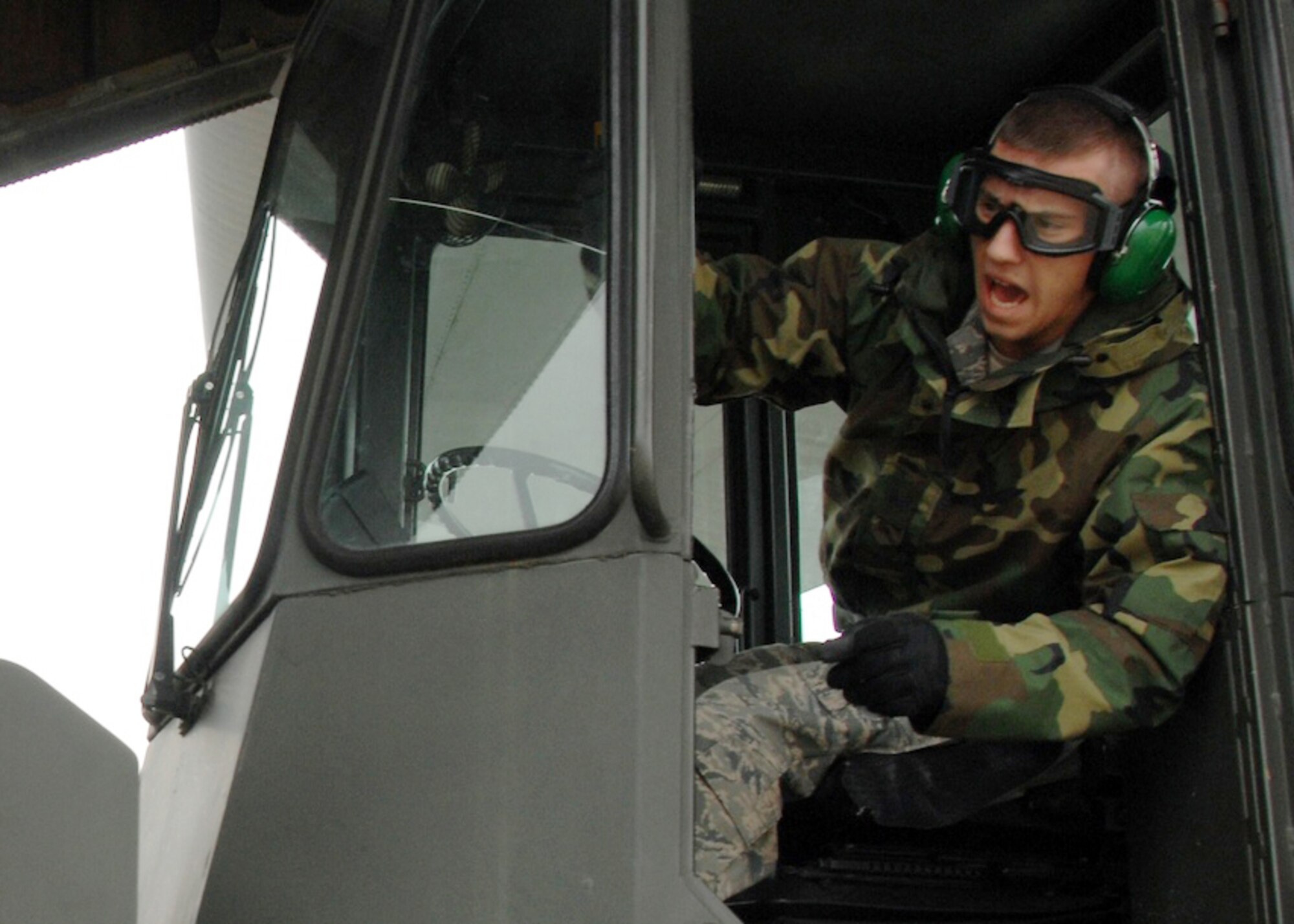 Senior Airman Thomas Moore, 32nd Aerial Port Squadron from Pittsburgh Air Reserve Base, loads a pallet during the engines running on- off-load event in the first 22nd Air Force Aerial Port ROUNDUP at Dobbins Air Reserve Base, Georgia. The 32 APS placed in the top three overall rating for the competition. (U.S. Air Force photo/1st Lt. J. Justin Pearce)