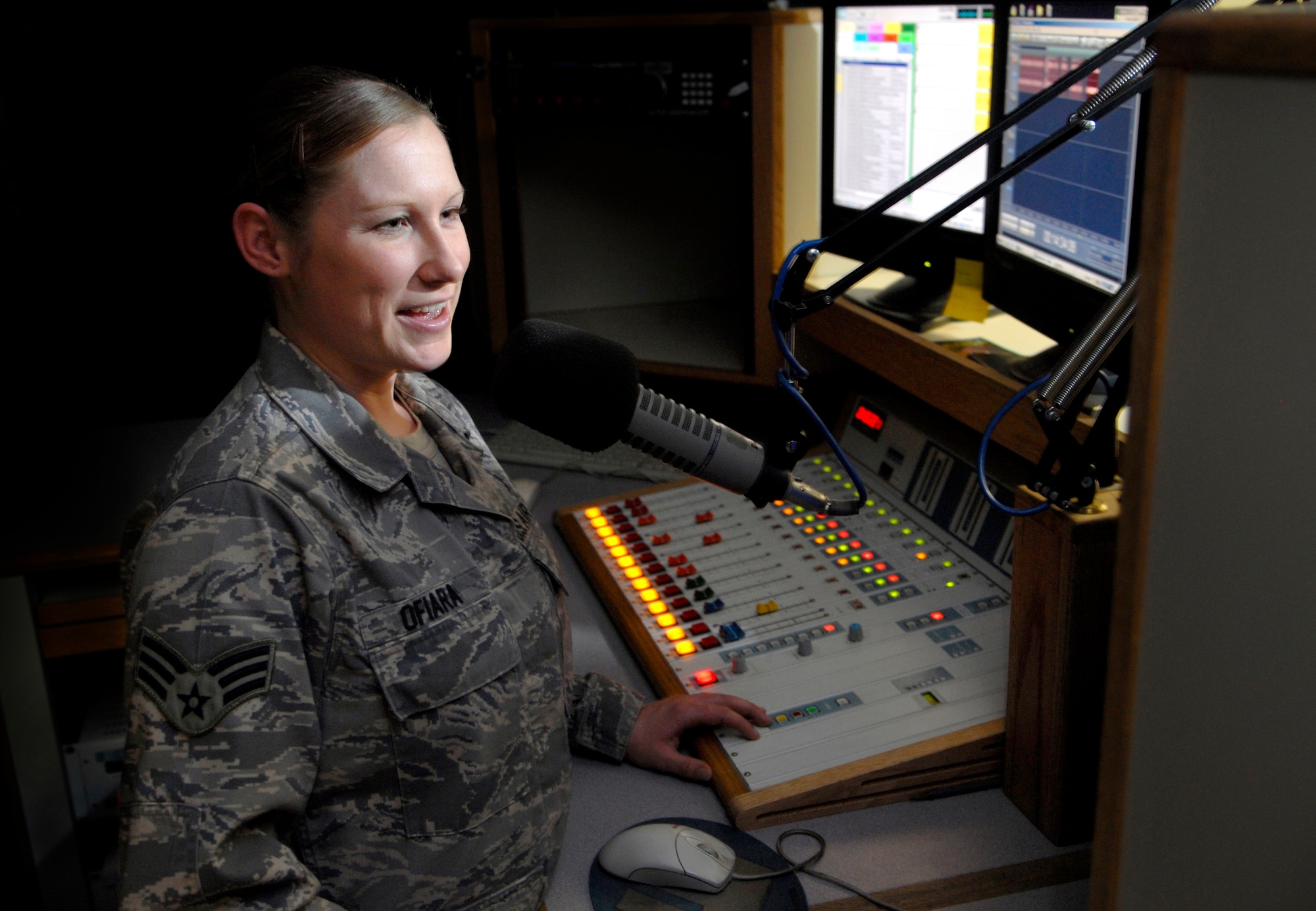 Senior Airman Shannon Ofiara informs listeners of events around the Republic of Korea as she broadcasts a radio show at American Forces Network, Osan. (U.S. Air Force photo/Staff Sgt. Brian Ferguson)  