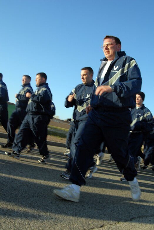 Edwards Airmen run during an installation fitness run along FitzGerald Boulevard March 13. More than 700 Airmen, both military and civilian, participated in the event. (U.S. Air Force photo/Senior Airman Julius Delos Reyes)