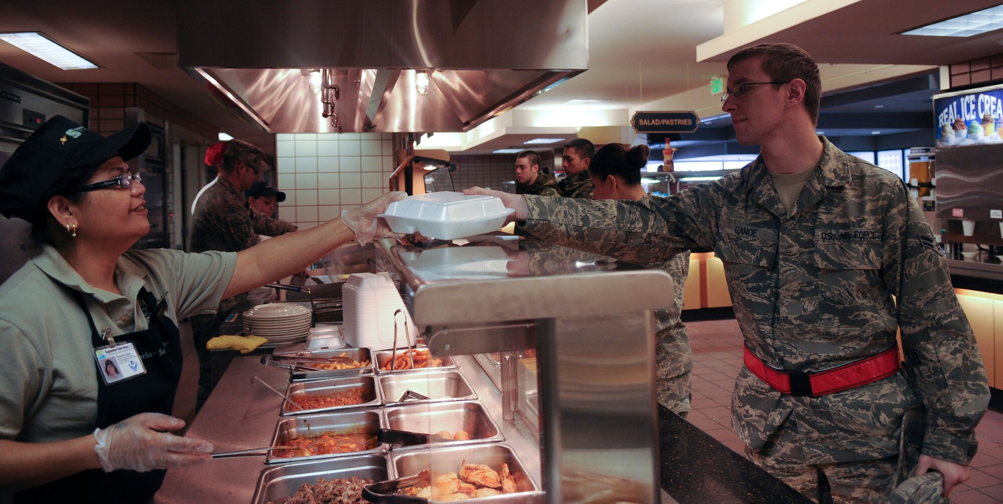 Airmen are served at the Two Seasons dining facility March 12, 2009, Eielson Air Force Base, Alaska. The dining facility serves a variety of foods to satisfy different tastes. (U.S. Air Force photo/Airman 1st Class Laura Max)