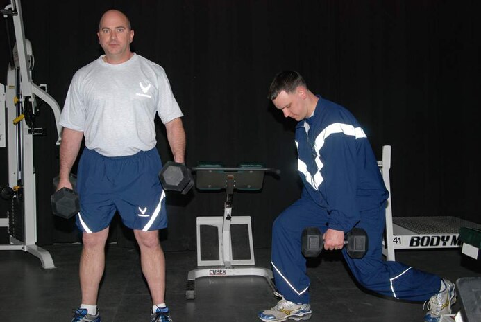 Master Sgt. James Lynn (left) and Capt. Nick Ferry workout in the uniforms that are currently being tested at Wright-Patterson Air Force Base, Ohio, and elsewhere. A prototype physical training uniform for the Air Force is undergoing wear testing here, the Pentagon and MacDill AFB, Fla. Sergeant Lynn is a subject matter expert and Captain Ferry is the manager for the PT uniform. Both Airmen are with the Air Force Uniform Ofifce. (U.S. Air Force photo/Bonnie White)
