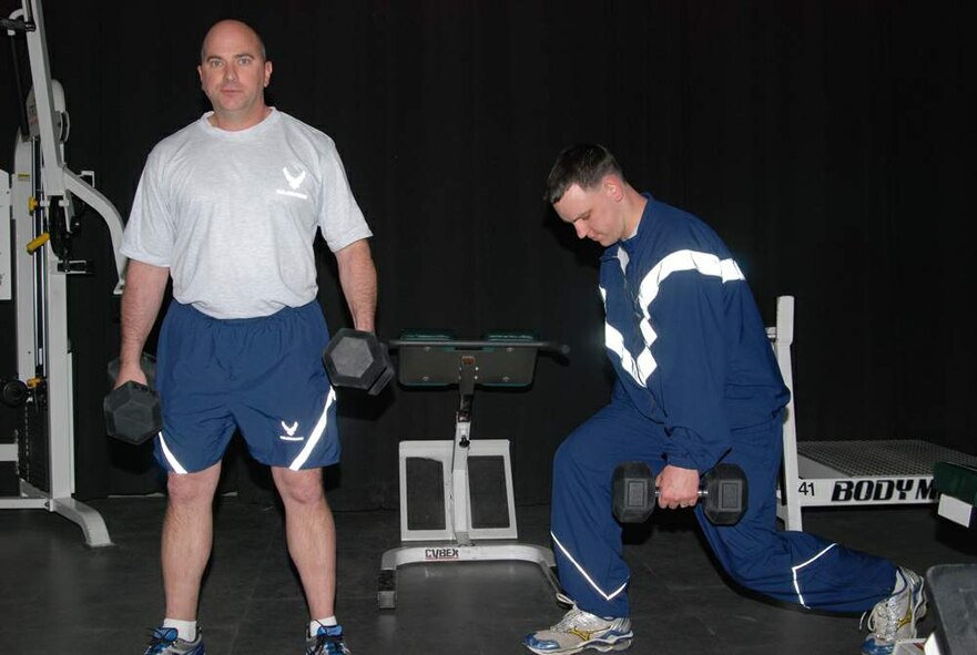 Master Sgt. James Lynn (left) and Capt. Nick Ferry workout in the uniforms that are currently being tested at Wright-Patterson Air Force Base, Ohio, and elsewhere. A prototype physical training uniform for the Air Force is undergoing wear testing here, the Pentagon and MacDill AFB, Fla. Sergeant Lynn is a subject matter expert and Captain Ferry is the manager for the PT uniform. Both Airmen are with the Air Force Uniform Ofifce. (U.S. Air Force photo/Bonnie White)
