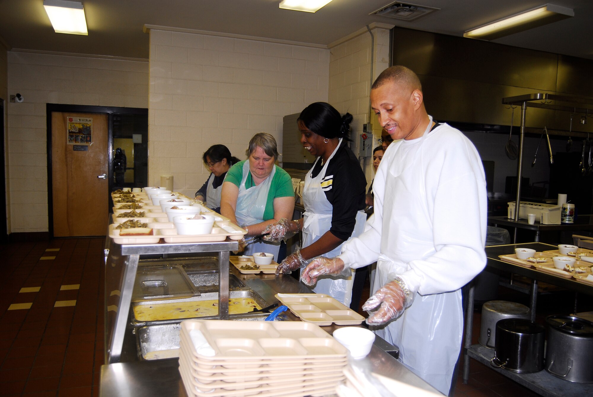 Master Sgt. Diego Brown, 43rd Force Support Squadron, Crystal Moore, 43rd Airlift Wing Command Post, Ann Mulvaney, 43rd Comptroller Squadron and Senior Master Sgt. Carolyn Bullock, 43rd CPTS, serve dinner at the Salvation Army, located at 245 Alexander Street in downtown Fayetteville March 14. The Salvation Army’s kitchen staff need volunteers to serve meals during the week, especially on Sundays between 4:30 to 6 p.m. They are also in need of donations from potholders to various food items. Volunteers are invited to even bring and cook their own specialty dishes as long as it is planned in advance with the kitchen staff. For more information on volunteering or donating items, call David Munoz at 689-8505 or call the kitchen line directly at 485-8026. 