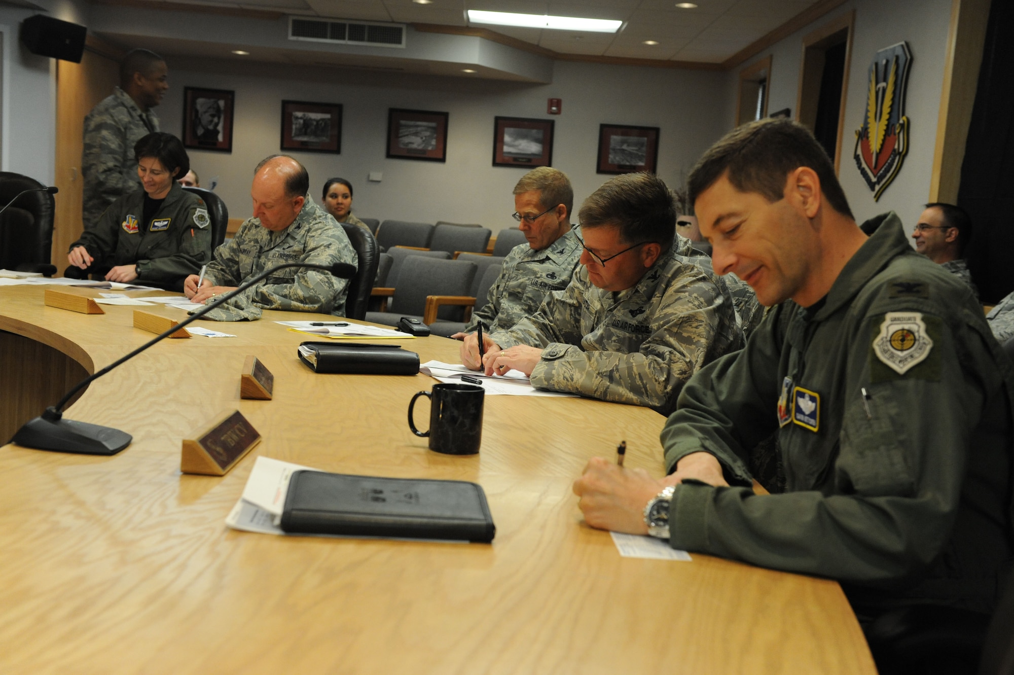 DYESS AIR FORCE BASE, Texas - Col. Gavin Ketchin, 7th Bomb Wing vice commander (right) fill out his Air Force Assistance Fund worksheet March 12 with other group commanders during the senior leadership meeting. Airmen interested in contributing to the AFAF can contact their unit POC or Capt. Rodney Heard, 7th Bomb Wing AFAF project officer.  (U.S. Air Foce photo by Senior Airman Domonique Simmons)