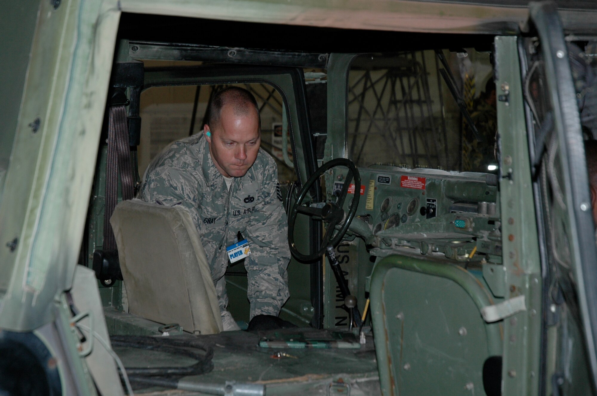 Tech. Sgt. Michael Gray, 38th Aerial Port Squadron ROUNDUP team member, inspects the interior of a HUMVEE during the joint inspection event at the 22nd Air Force Aerial Port ROUNDUP at Dobbins Air Reserve Base in Atlanta March 15. During the competition 18 aerial port squadrons from the 22 AF vied for the top spot in six events, which test their efficiency and safety in various aerial port functions. (U.S. Air Force photo/Capt. Bryan Lewis)  