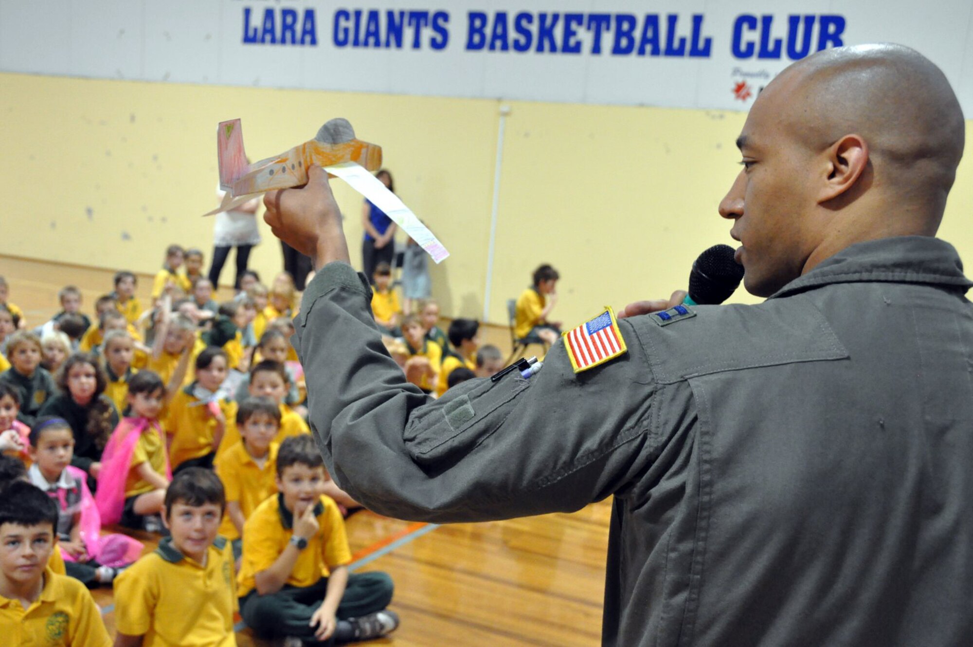 GEELONG, Victoria, Australia -- Capt. Makia Epie, C-5 pilot, shows a captive audience how his plane is able to take off and stay in the sky in the nearby town of Lara March 12. The captain visited the school with several Air Force aviators and talked to the curious Australian students ages 5 and 6, and 11 and 12 about their lives in the U.S. Air Force. Captain Epie is here with his C-5 crew to support the 2009 Australian International Airshow held at Avalon Airport here.The show has been held every second year since 1989. (U.S.  Air Force photo/Tech Sgt. Cohen A. Young) 