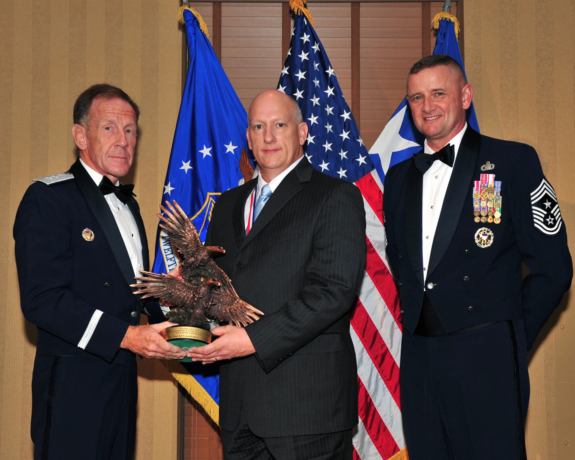 DAVIS MONTHAN AIR FORCE BASE, Ariz. - Two members of the Dyess Air Force Base team were honored for their outstanding performance in 2008 during the Twelfth Air Force (Air Forces Southern) Outstanding Performer of the Year banquet here March 11. Mr. David Laurence, 7th CES Environmental Flight chief received the award in the senior grade civilian category.  (U.S. Air Force photo)