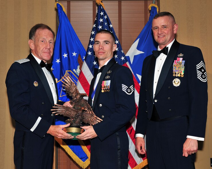 DAVIS MONTHAN AIR FORCE BASE, Ariz. - Two members of the Dyess Air Force Base team were honored for their outstanding performance in 2008 during the Twelfth Air Force (Air Forces Southern) Outstanding Performer of the Year banquet here March 11. Staff Sgt. Ryan Oliver, 7th Civil Engineer Squadron explosive ordnance disposal craftsman, received the award in the NCO category.  Staff Sgt. Oliver received the Bronze Star Medal for combat actions in Iraq.  He led a three-man team on 43 improvised explosive device search-and-destroy missions, making safe a 2,000 mile main supply route.  He also executed a two-day raid with special operations forces on a safe house, denying the enemy use of five additional IEDs. (U.S. Air Force photo)