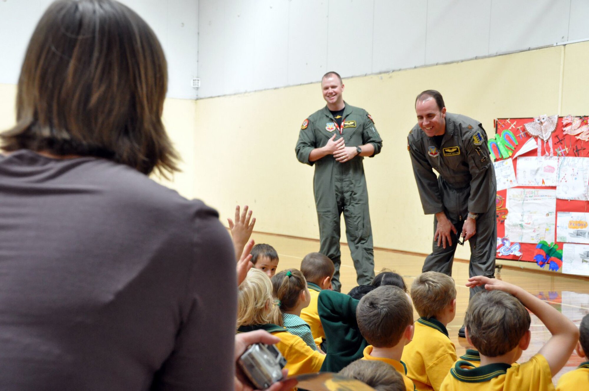 GEELONG, Victoria, Australia -- B1-B navigator Capt. Bob Stinson and B1-B pilot Maj. Norman Shelton from the 37th Bomber Squadron at Ellsworth Air Force Base, S.D., share stories with excited young students of Lara Primary School in nearby Lara March 12. Captain Stinson and Major Shelton visited the school and talked to the Australian students ages 5 and 6, and 11 and 12 about their lives in the U.S. Air Force. Two B1-Bs from Ellsworth AFB are here to support the 2009 Australian International Airshow held at Avalon Airport near here. The show has been held every second year since 1989. (U.S. Air Force photo/Tech. Sgt. Cohen A. Young) 