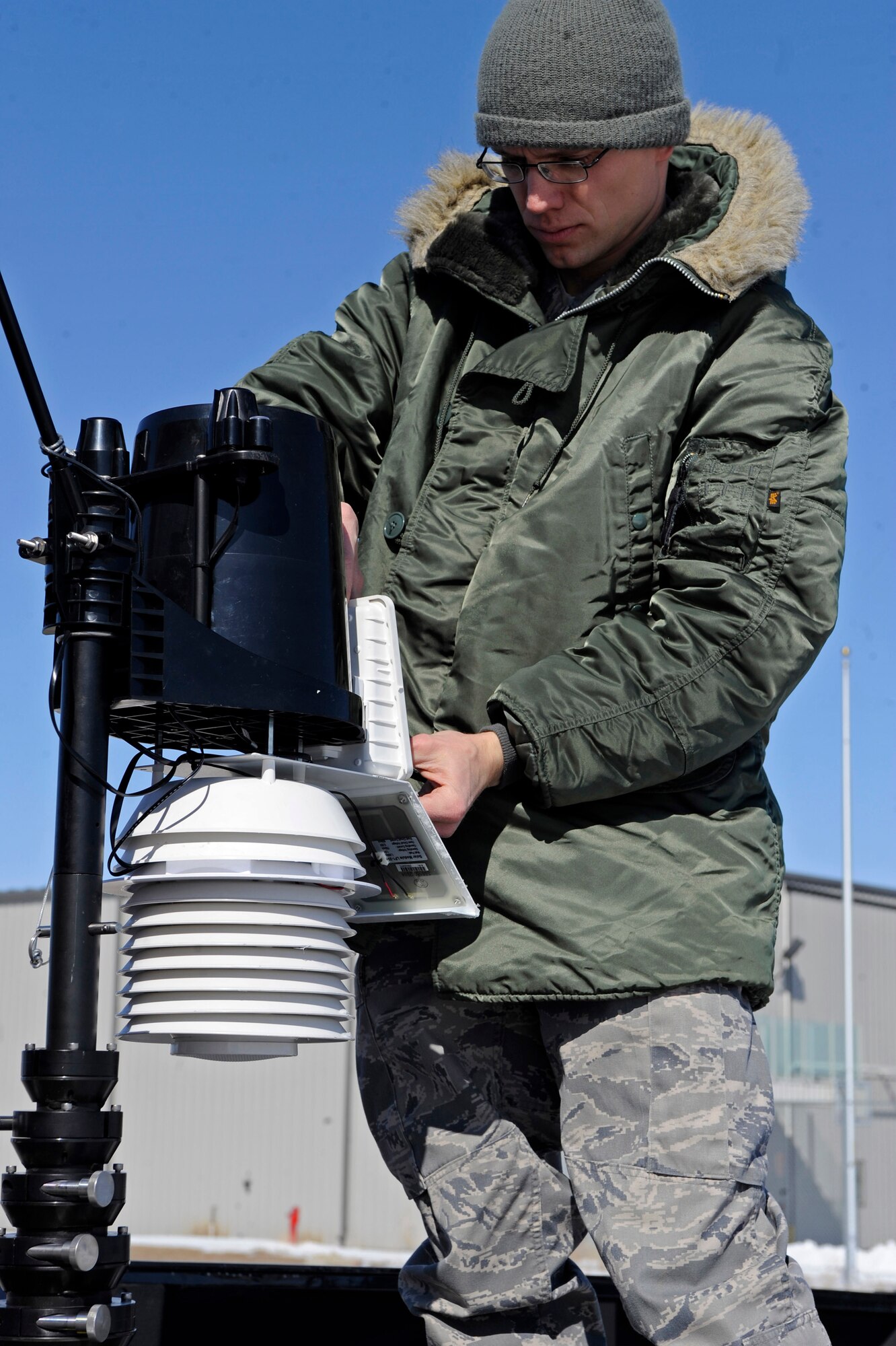 Senior Airman Daniel Van Stone, 28th Civil Engineer Squadron emergency management technician, sets up a weatherpak during an antiterrorism exercise at Rapid City Regional Airport, S.D., March 12.  The weatherpak extracts local weather information from the air to provide the mobile emergency operations center with the most up to date weather information. Ellsworth Airmen teamed up with their civilian counterparts during the exercise, in an effort to develop a working relationship and become familiar with the policies and procedures of each other. (U.S. Air Force photo/Airman 1st Class Matthew Flynn)