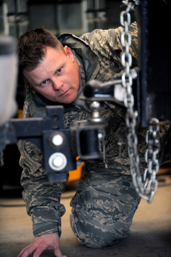 Master Sgt. Dennis Griffith, 28th Civil Engineer Squadron NCO in-charge of readiness, ensures the mobile emergency operations center trailer connects properly to an emergency management vehicle here, March 12. Part of the objective for the exercise was to determine a timeframe for the EM flight to depart the installation and travel to Rapid City Regional Airport in order to support civil authorities in the case of a natural or manmade disaster. Ellsworth Airmen teamed up with their civilian counterparts during the exercise, in an effort to develop a working relationship and become familiar with the policies and procedures of each other. (U.S. Air Force photo/Airman 1st Class Matthew Flynn)