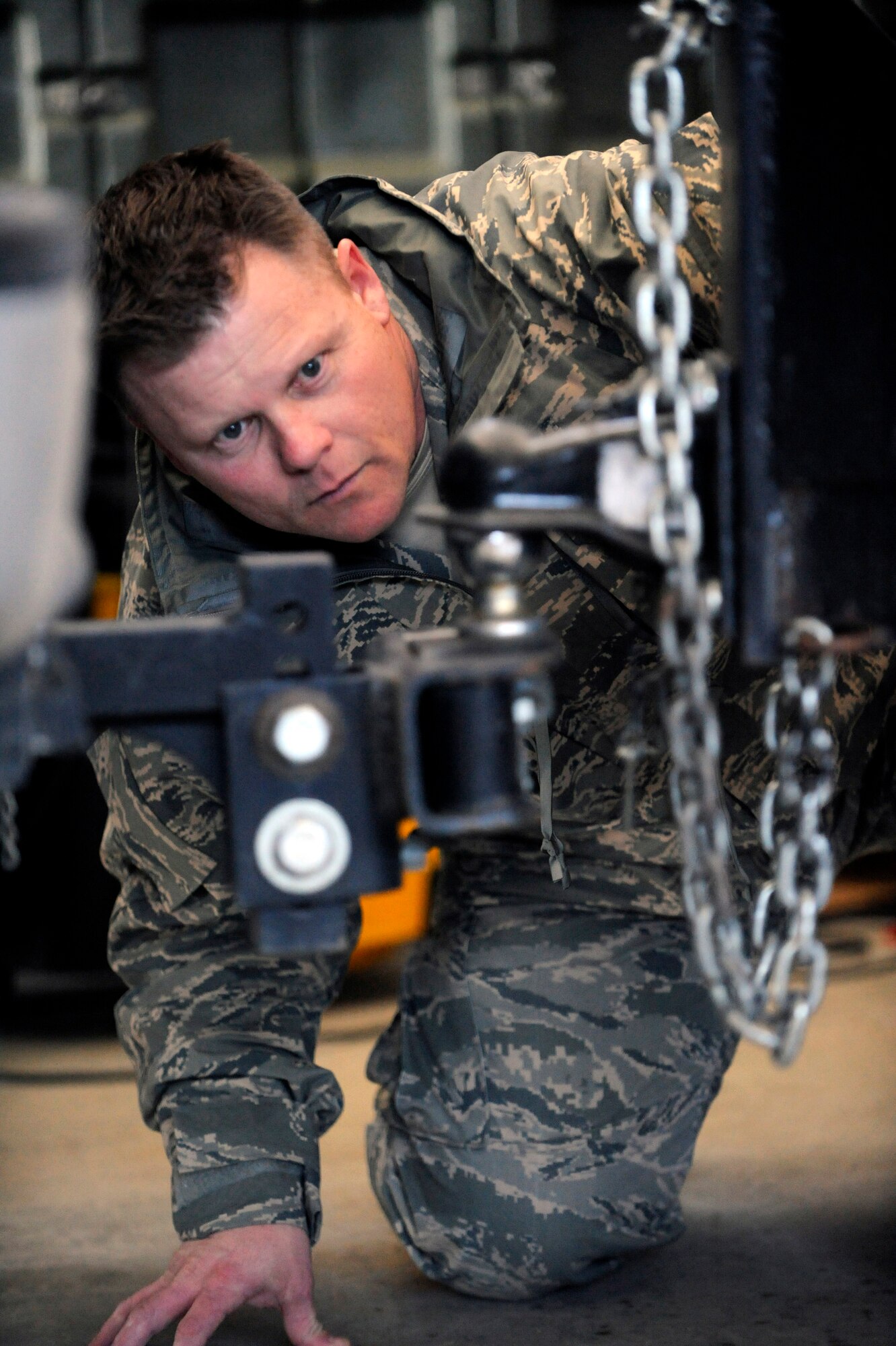 Master Sgt. Dennis Griffith, 28th Civil Engineer Squadron NCO in-charge of readiness, ensures the mobile emergency operations center trailer connects properly to an emergency management vehicle here, March 12. Part of the objective for the exercise was to determine a timeframe for the EM flight to depart the installation and travel to Rapid City Regional Airport in order to support civil authorities in the case of a natural or manmade disaster. Ellsworth Airmen teamed up with their civilian counterparts during the exercise, in an effort to develop a working relationship and become familiar with the policies and procedures of each other. (U.S. Air Force photo/Airman 1st Class Matthew Flynn)