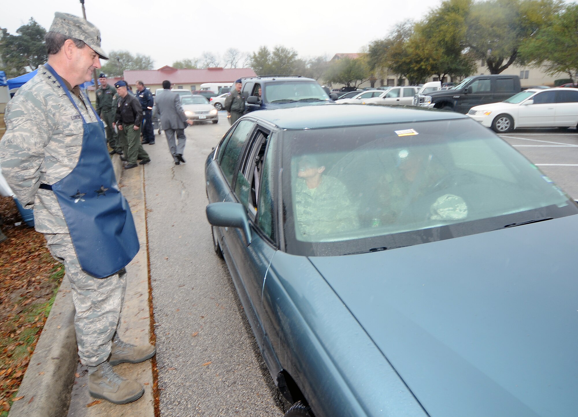 Gen. Stephen Lorenz, Air Education and Training Command commander, takes an order from Master Sgt. Mindy Stifflemire and Tech. Sgt. Tania Merriwether during the Air Force Assistance Fund kickoff lunch March 12 in the chapel annex parking lot. The AFAF campaign kicked off for the 12th Flying Training Wing, and General Lorenz stopped by during his tour of Randolph to help jump start the fundraiser. (U.S. Air Force photo by Steve White)