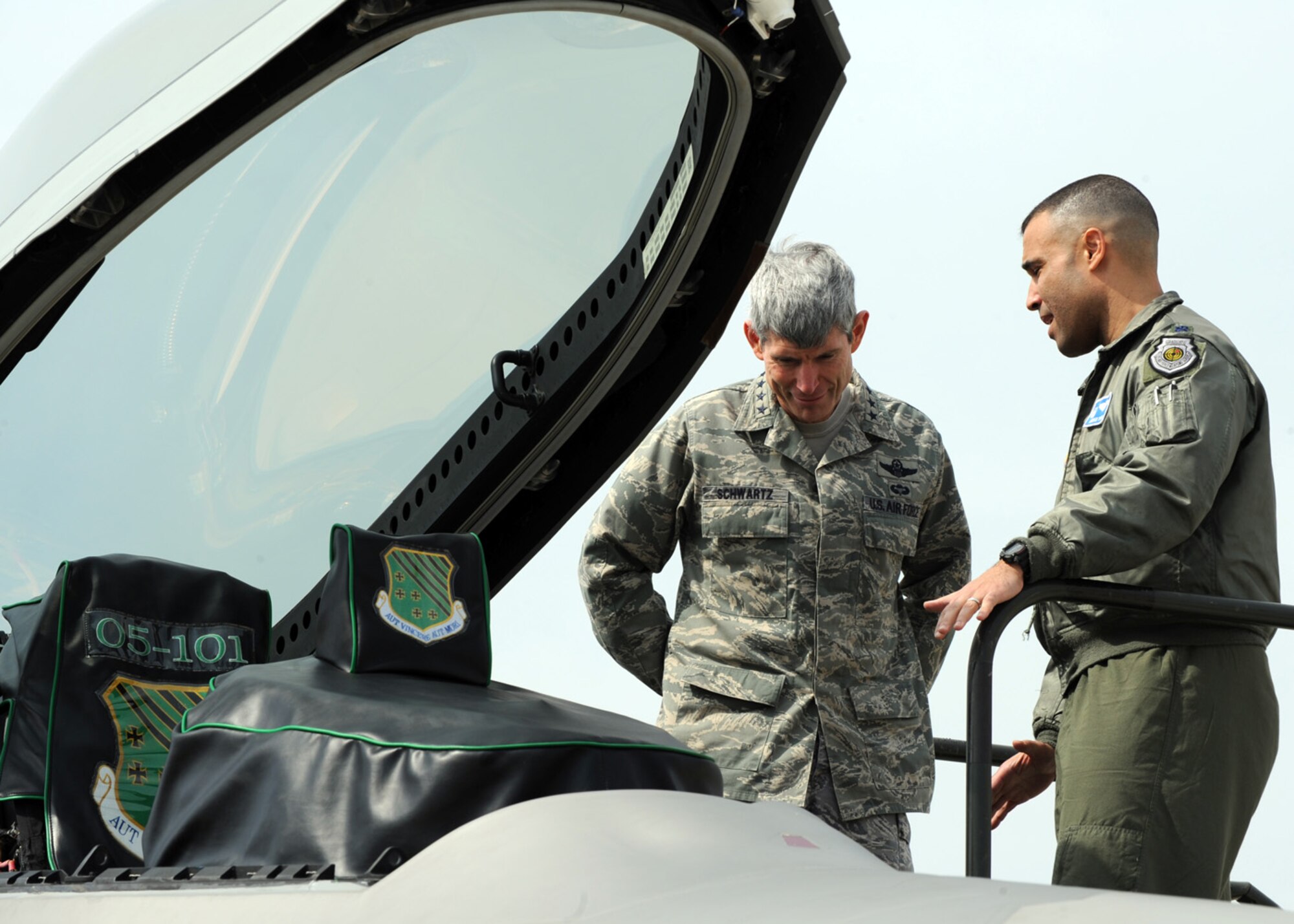 LANGLEY AIR FORCE BASE, Va. -- Gen. Norton Schwartz, former Chief of Staff of the Air Force, is briefed by Lt. Col. Adrian Spain, 94th Fighter Squadron commander, on the capabilities of the F-22A Raptor March 11. General Schwartz reviewed Langley’s war fighting capabilities, viewed an F-22A demonstration, and held an Airmen's Call. (U.S. Air Force photo/Airman 1st Class Jonathan Koob)