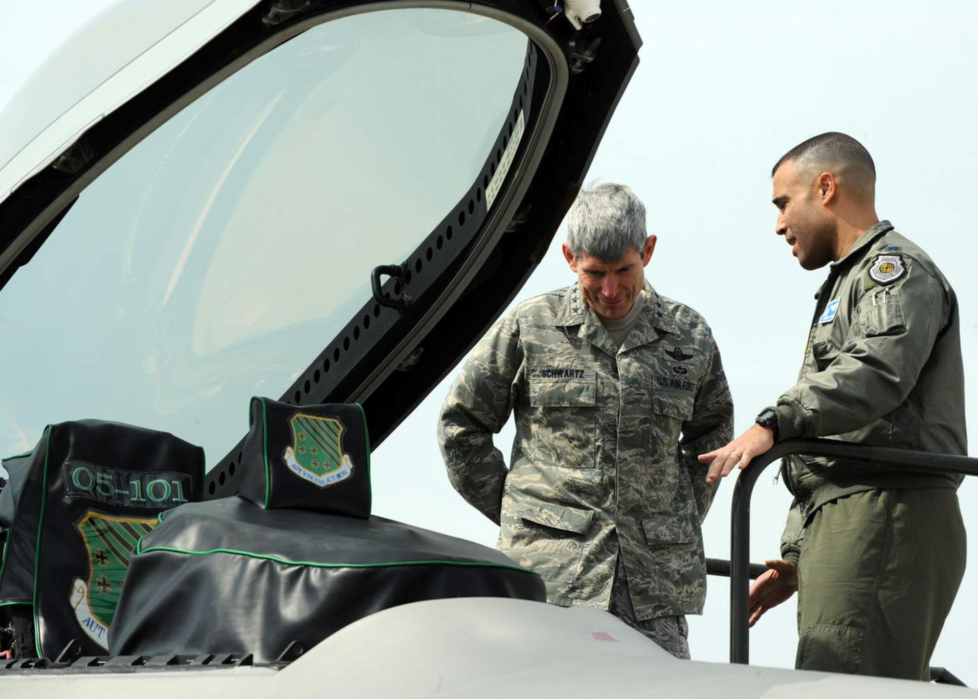 General Norton Schwartz is briefed by Lt. Col. Adrian Spain on the capabilities of the F-22 Raptor March 11 at Langley Air Force Base, Va. General Schwartz, the Air Force chief of staff, reviewed Langley AFB's warfighting capabilities, viewed an F-22 demonstration, and held a town hall meeting with Airmen. Colonel Spain is the 94th Fighter Squadron commander. (U.S. Air Force photo/Airman 1st Class Jonathan Koob) 
