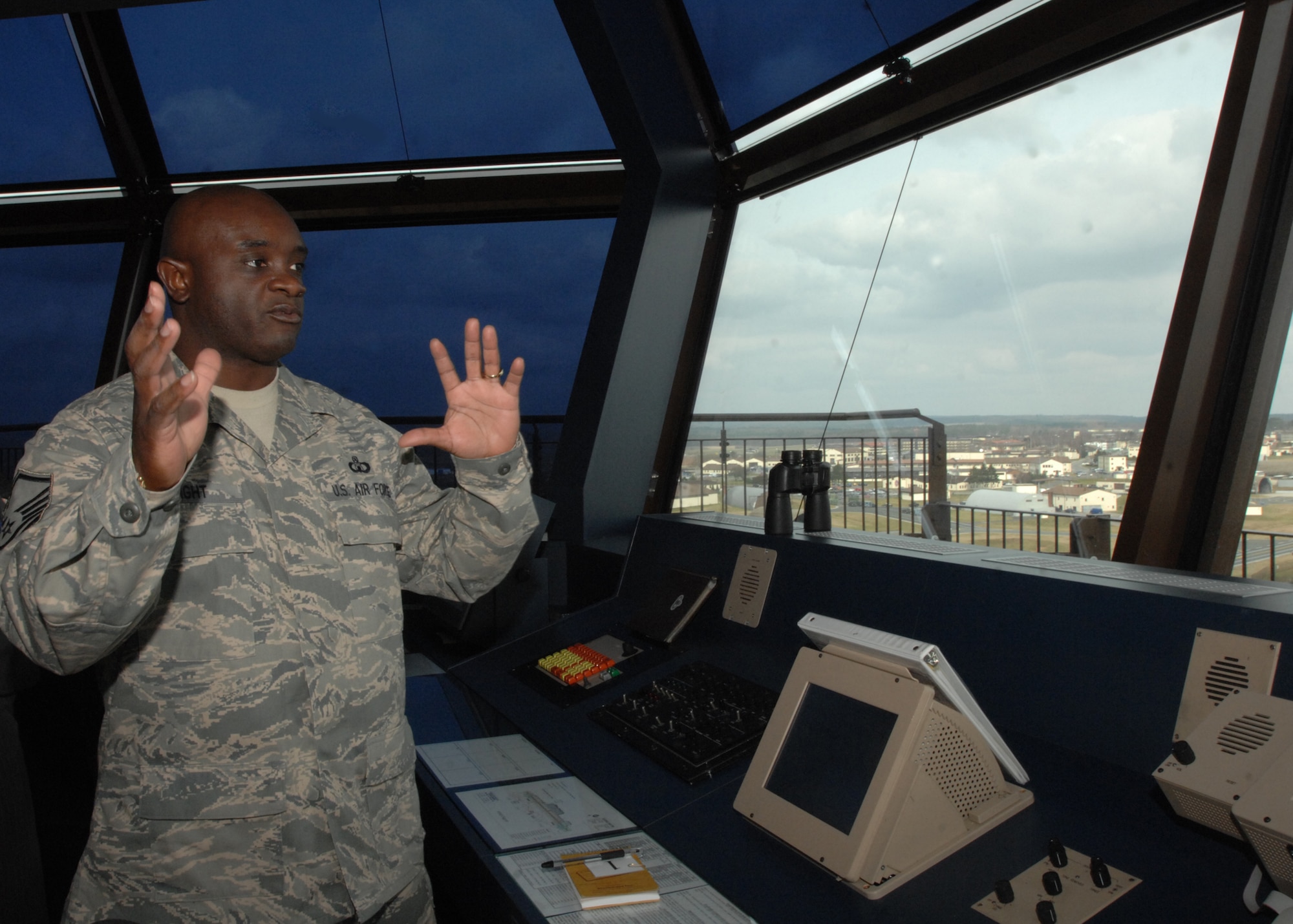 SPANGDAHLEM AIR BASE, Germany -- Master Sgt. Marcus Wright, 52nd Operations Support Squadron, gives leadership and local nationals a tour of the new Air Traffic Control Tower after the Air Traffic Control Tower ribbon cutting ceremony March 13, 2009.  The new tower gives air traffic controllers a view of the entire flight line. It houses state-of-the-art equipment and a simulator for training.  .  (U.S. Air Force photo by Senior Airman Jenifer H. Calhoun)