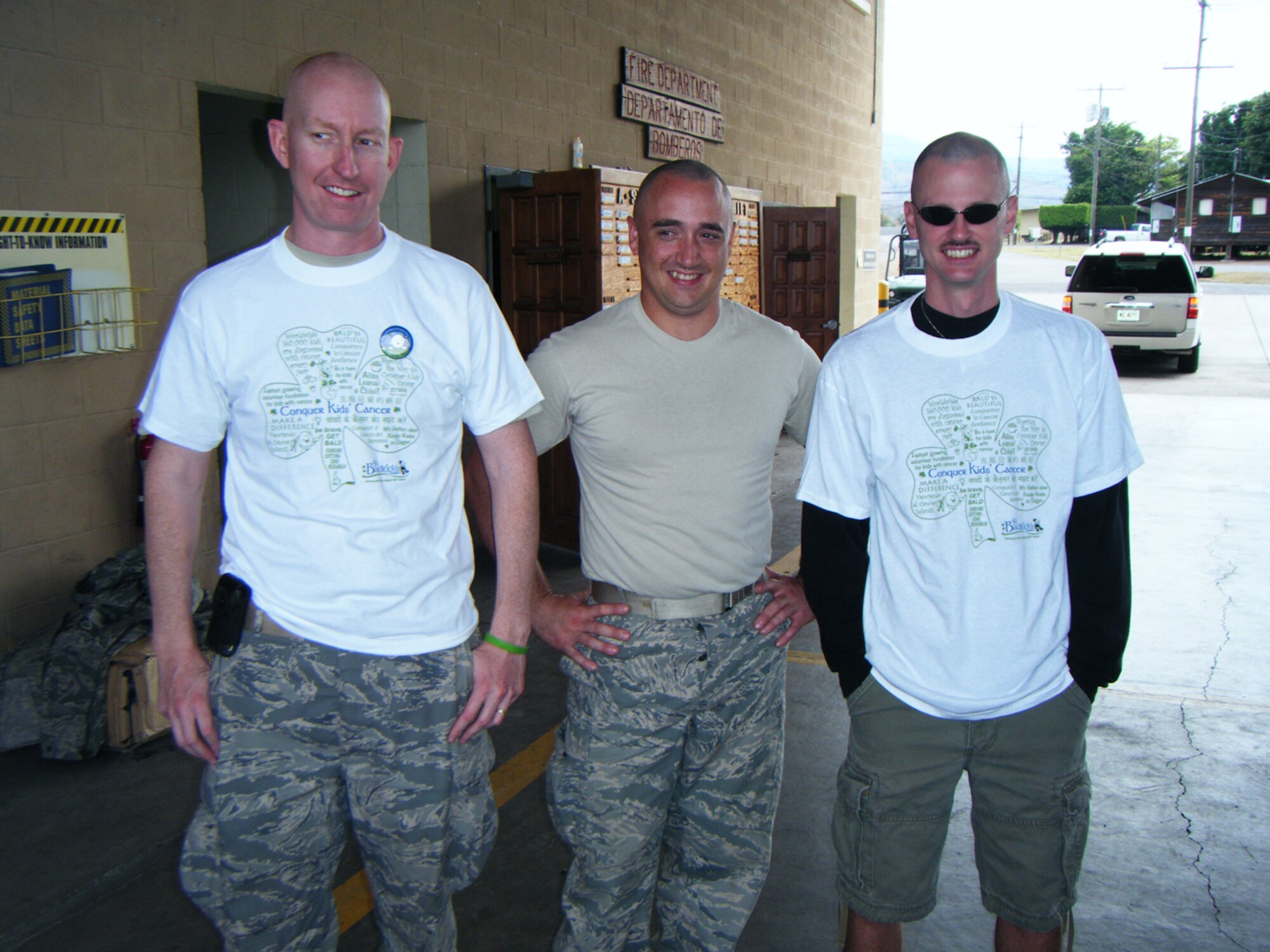 SEYMOUR JOHNSON AIR FORCE BASE, N.C. -- Tech. Sgt. Charles Alford (right) shows his new haircut in honor of St. Baldrick's Foundation. Sgt. Alford, a Reservist with the 916th Communication Squadron, is currently deployed to Soto Cano Air Base, Honduras. St. Baldrick's Foundation supports cancer research for children.