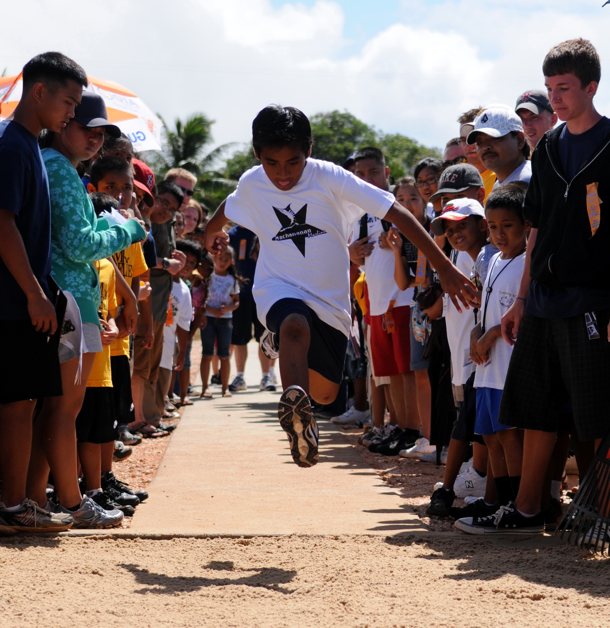 ANDERSEN AIR FORCE BASE, Guam – A Machananao Marlins Olympian jumps with all his might during the 33rd Annual Special Olympics Track and Field Competition held at Okkodo High School track March 14. Andersen's 554th RED HORSE Squadron along with Guam donators made it possible for Olympians to compete in long jump by building the sand pit. (U.S. Air Force photo by Airman 1st Class Courtney Witt)

