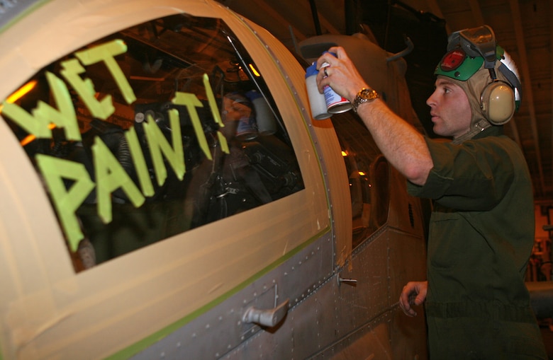 Cpl. Jeremy D. Haile, an airframes mechanic with Marine Medium Tiltrotor Squadron 263 (Reinforced), 22nd Marine Expeditionary Unit, and native of Lancaster, S.C., uses aircraft paint to touch up dozens of screws on an AH-1W Super Cobra aboard USS Bataan March 16, 2009 during the MEU's certification exercise. The CERTEX is the last required training evolution before the MEU deploys this spring.  (Official Marine Corps photo by Cpl. Justin M. Martinez)