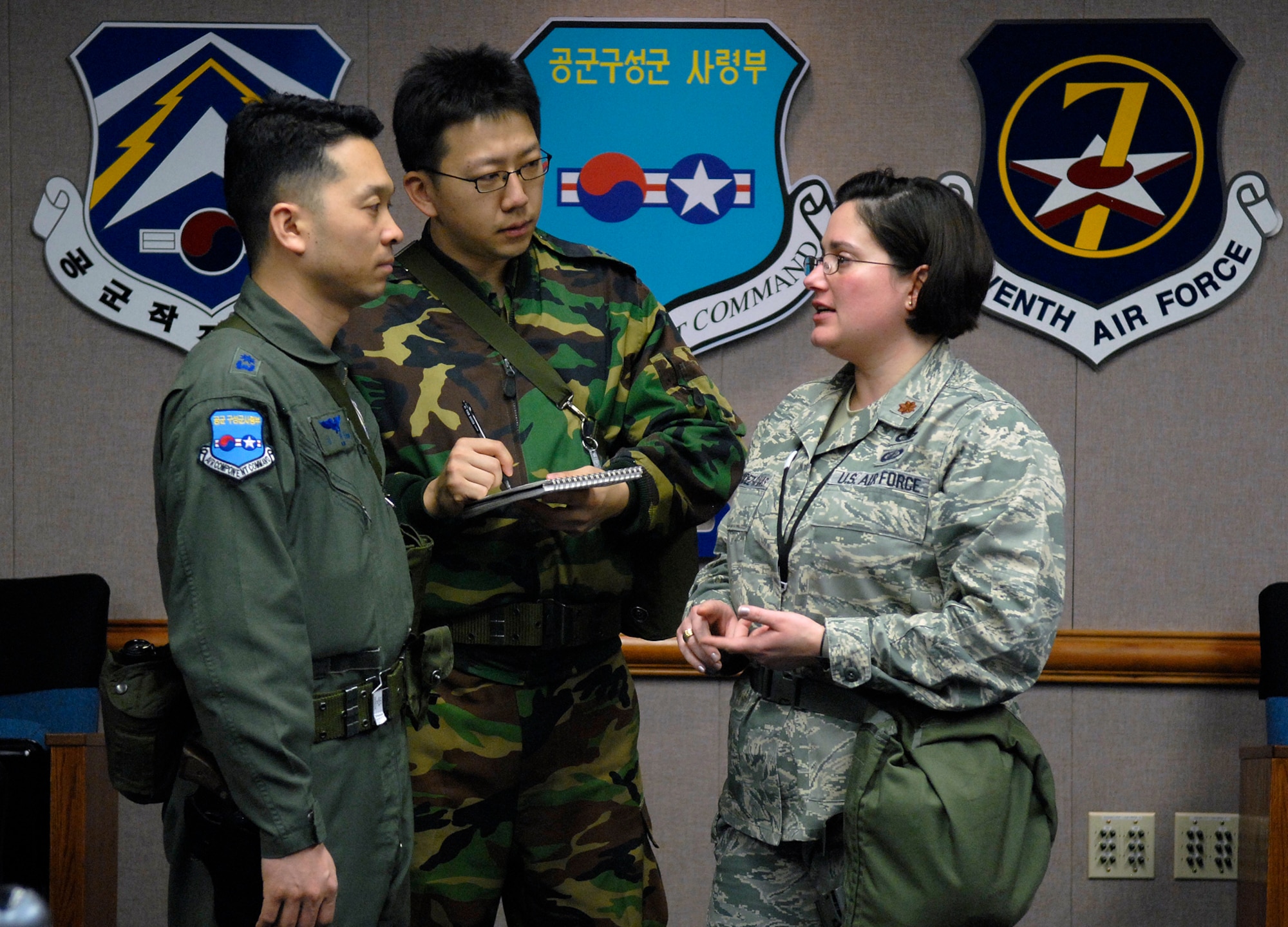 OSAN AIR BASE, Republic of Korea --  U.S. Air Force Maj. Miralba C. Fernandez-Covas works closely with her Korean counterparts Republic of Korea Air Force Maj. Kim, Heonjoong and ROKAF 1st. Lt. Cho, Sungmin, all three from Air Component Command’s joint plans and coordination (ACC/PJ).  With more than two thousand Airmen, Soldiers, Marines and Sailors participating jointly with ROK air force, communication has to be clear and centralized across the spectrum of air and space power. KR/FE is an annual training exercise that demonstrates U.S. resolve to support the Republic of Korea against external aggression while improving ROK-U.S. combat readiness and joint/combined interoperability. (U.S Air Force photo / Staff Sgt. Benjamin Rojek)