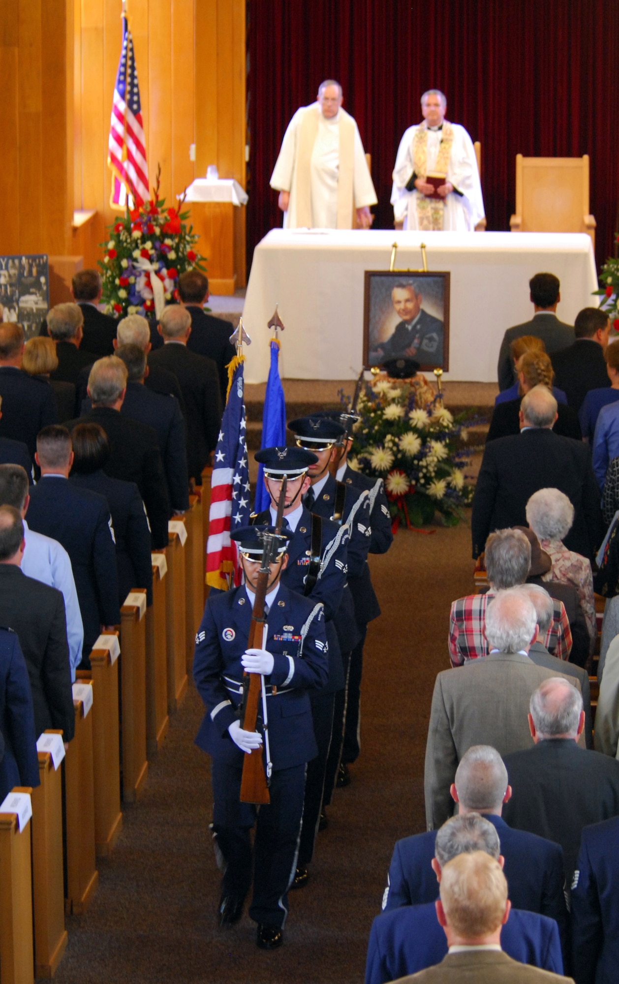 Members of the 325th Fighter Wing Honor Guard make their way out of the Tyndall Air Force Base Chapel March 16 after posting the Colors for the memorial service of the first Chief Master Sgt. of the Air Force, Paul W. Airey. Chief Airey died March 11, 2009 in Panama City, Fla.; he was 85 years old. (U.S. Air Force photo/Lisa Norman) 
