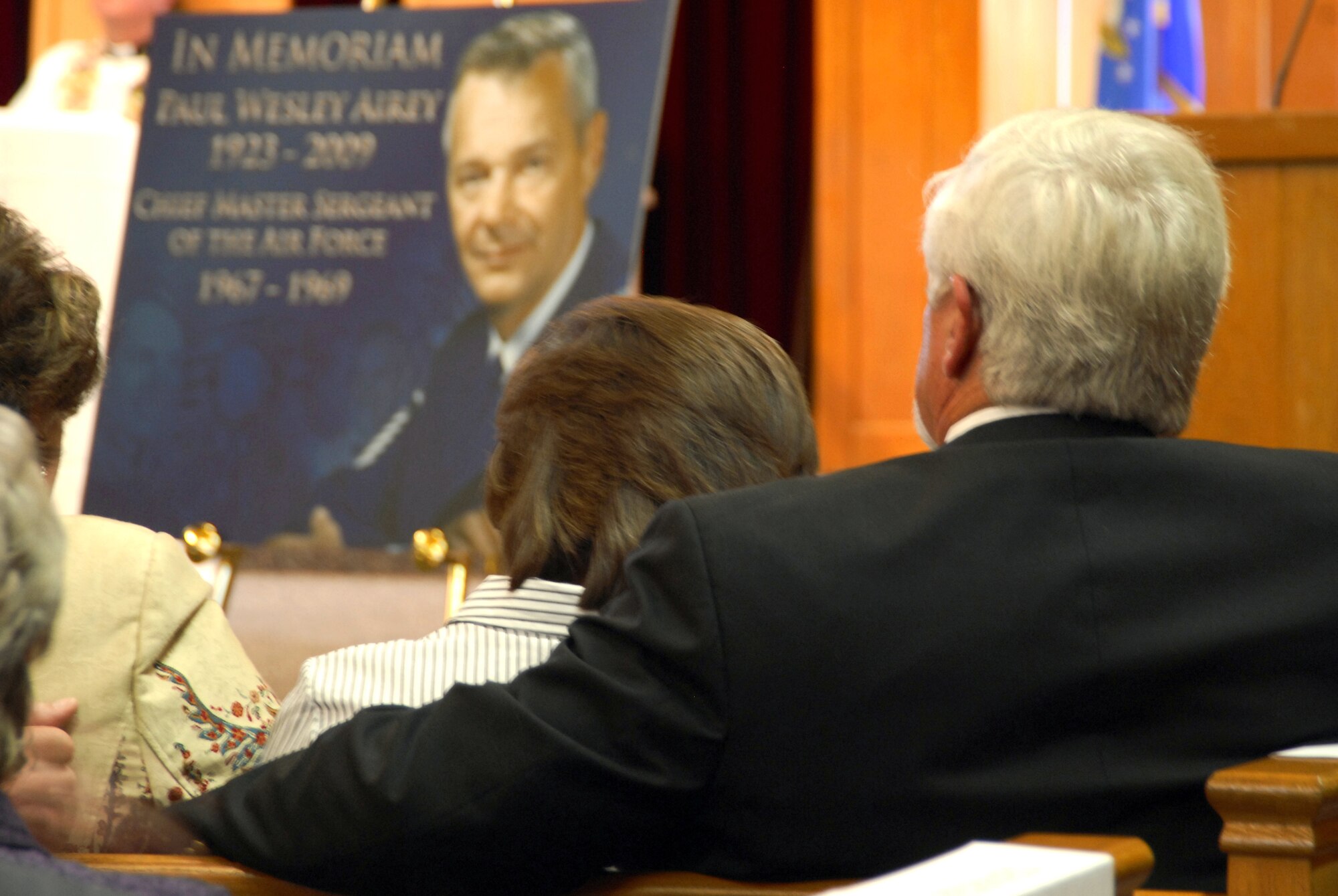 Retired Air Force Chief Master Sgt. Dale Airey, son of the first Chief Master Sgt. of the Air Force, Paul W. Airey, and his wife Norma look fondly at a memorial plaque created for their father's memorial service at Tyndall Air Force Base, Fla., March 16. Chief Paul W. Airey served for 27 years in the U.S. Air Force, retiring Aug. 1, 1970. He died March 11, 2009 in Panama City, Fla. (U.S. Air Force photo/Susan Trahan) 
