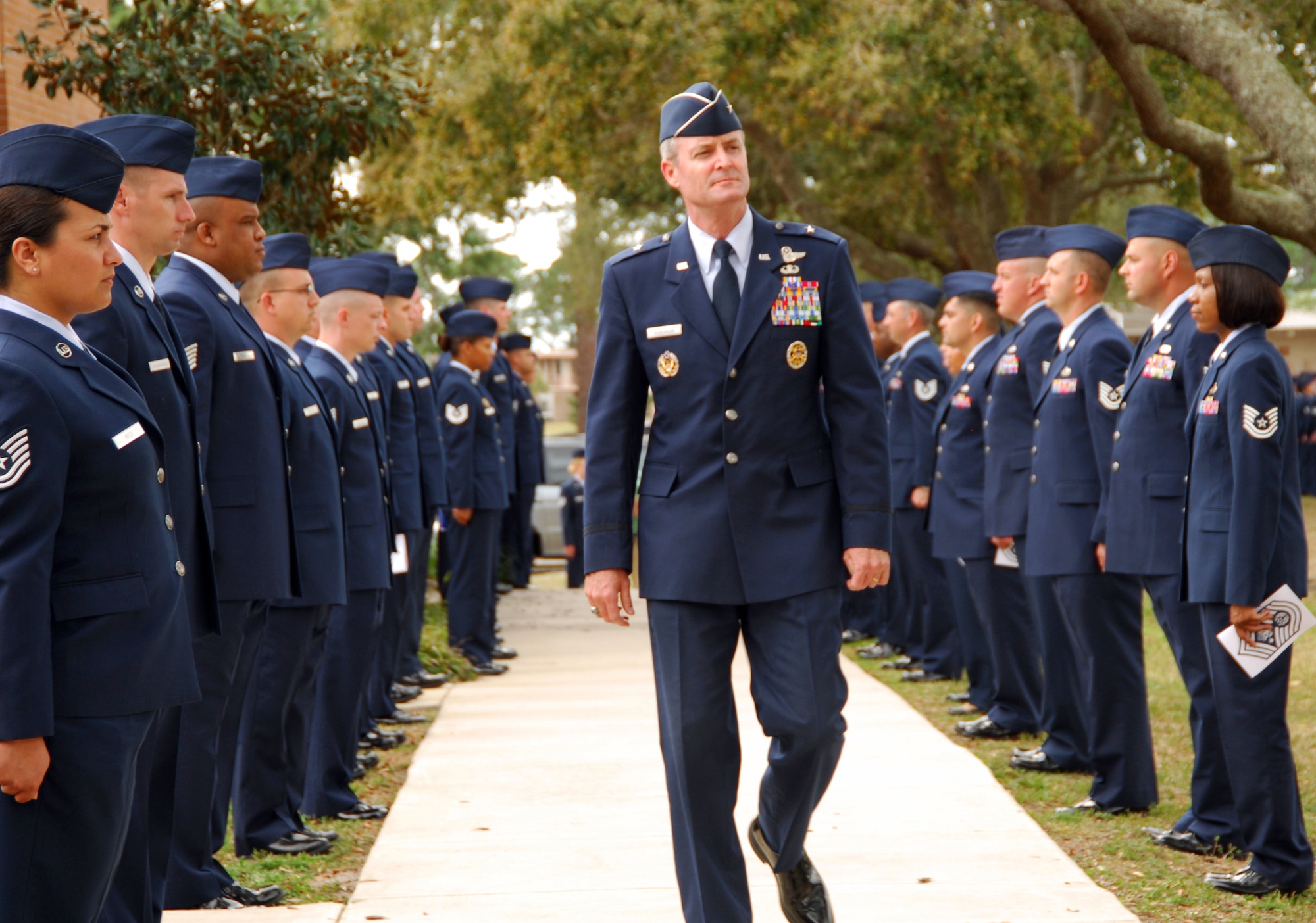Brig. Gen. Darryl Roberson, 325th Fighter Wing commander, makes his way to the entrance of the Tyndall Air Force Base Chapel March 16 where a memorial service for the first Chief Master Sgt. of the Air Force, Paul W. Airey, was held. He is flanked on either side by formations of Airmen from the Tyndall Paul W. Airey NCO Academy. Chief Airey spent 27 years in the Air Force, obtaining the rank of Chief Master Sgt. of the Air Force April 3, 1967. He retired Aug. 1, 1970 and died March 11, 2009. He was 85 years old. (U.S. Air Force photo/Susan Trahan) 

