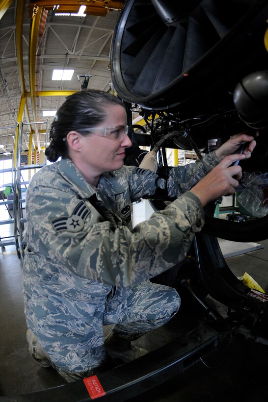 Senior Airman Deanna Neuharth, 28th Maintenance Squadron aerial space propulsion technician, makes final adjustments to a B-1B Lancer General Electric F101 turbofan engine here, March 17.  Airman Neuharth is one of three women working in the propulsion backshop. Since 1987, the month of March has been recognized as Women's History Month and highlights women of the past and future. (U.S. Air Force photo/Airman 1st Class Matthew Flynn)