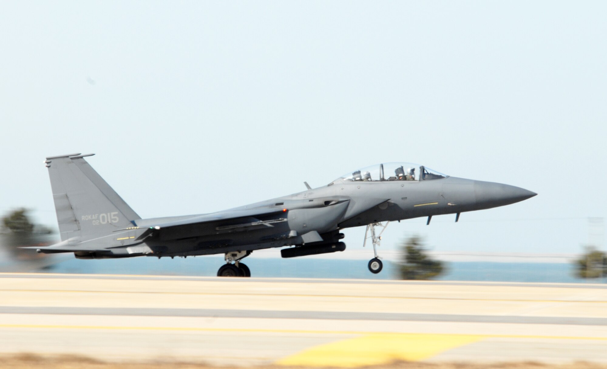 An F-15K Slam Eagle, Republic of Korea Air Forces', 11th A South Korean air force F-15K Slam Eagle from the 11th Tactical Fighter Wing takes off while participating in the Buddy Wing Exercise March 10 at Kunsan Air Base, South Korea. Members of the 8th Fighter Wing and 11th TFW are participating to practice and enhance combined air operations.(U.S. Air Force poto/Senior Airman Angela Ruiz) 
