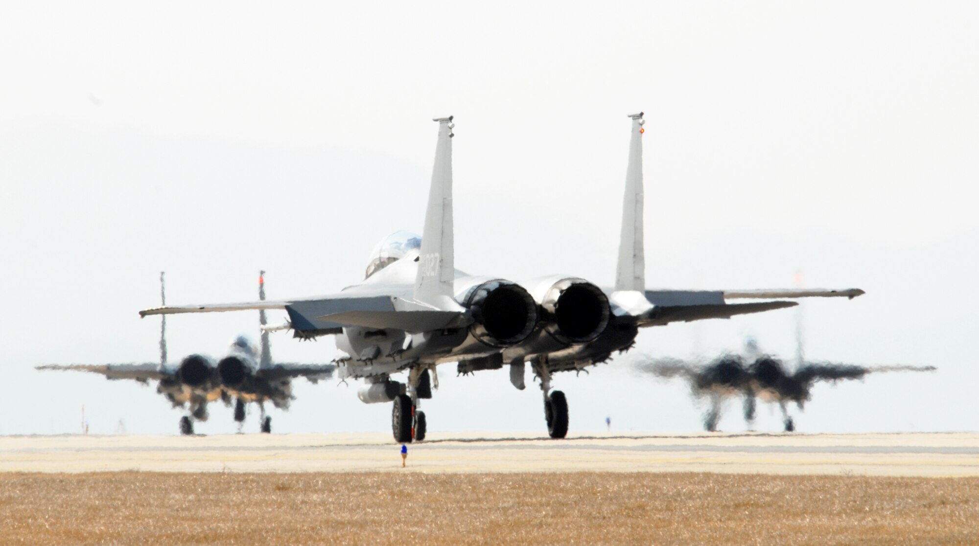 South Korean air force F-15K Slam Eagles from the 11th Tactical Fighter Wing taxi down the flightline prior to take off while participating in the Buddy Wing Exercise March 10 at Kunsan Air Base, South Korea. Members of the 8th Fighter Wing and 11th TFW are participating to practice and enhance combined air operations.(U.S. Air Force poto/Senior Airman Angela Ruiz) 
