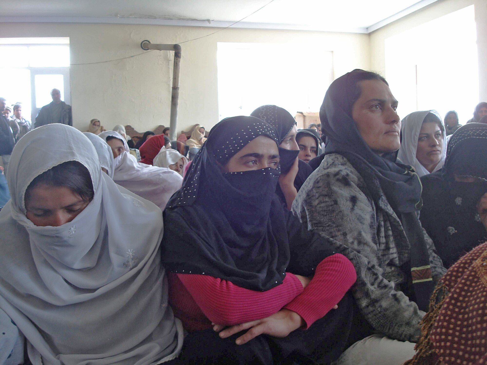 Nearly 125 women and girls listen to guest speakers during Panjshir's International Women's Day celebration March 8 at the Astana Guesthouse in Bazarak District in Afghanistan. (U.S. Air Force photo/Capt. Stacie N. Shafran) 
