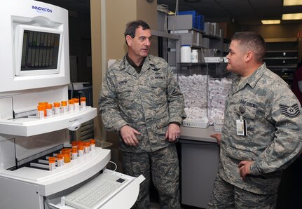Tech. Sgt. Andrew Salazar, pharmacy refill NCO in charge, explains pharmacy procedures to Gen. Stephen Lorenz, Air Education and Training Command commander, during a visit to the 12th Medical Group last week. General Lorenz visited the wing March 11-13 to learn about the mission and people who both work for and support the needs of the major command. (U.S. Air Force photo by Joel Martinez)