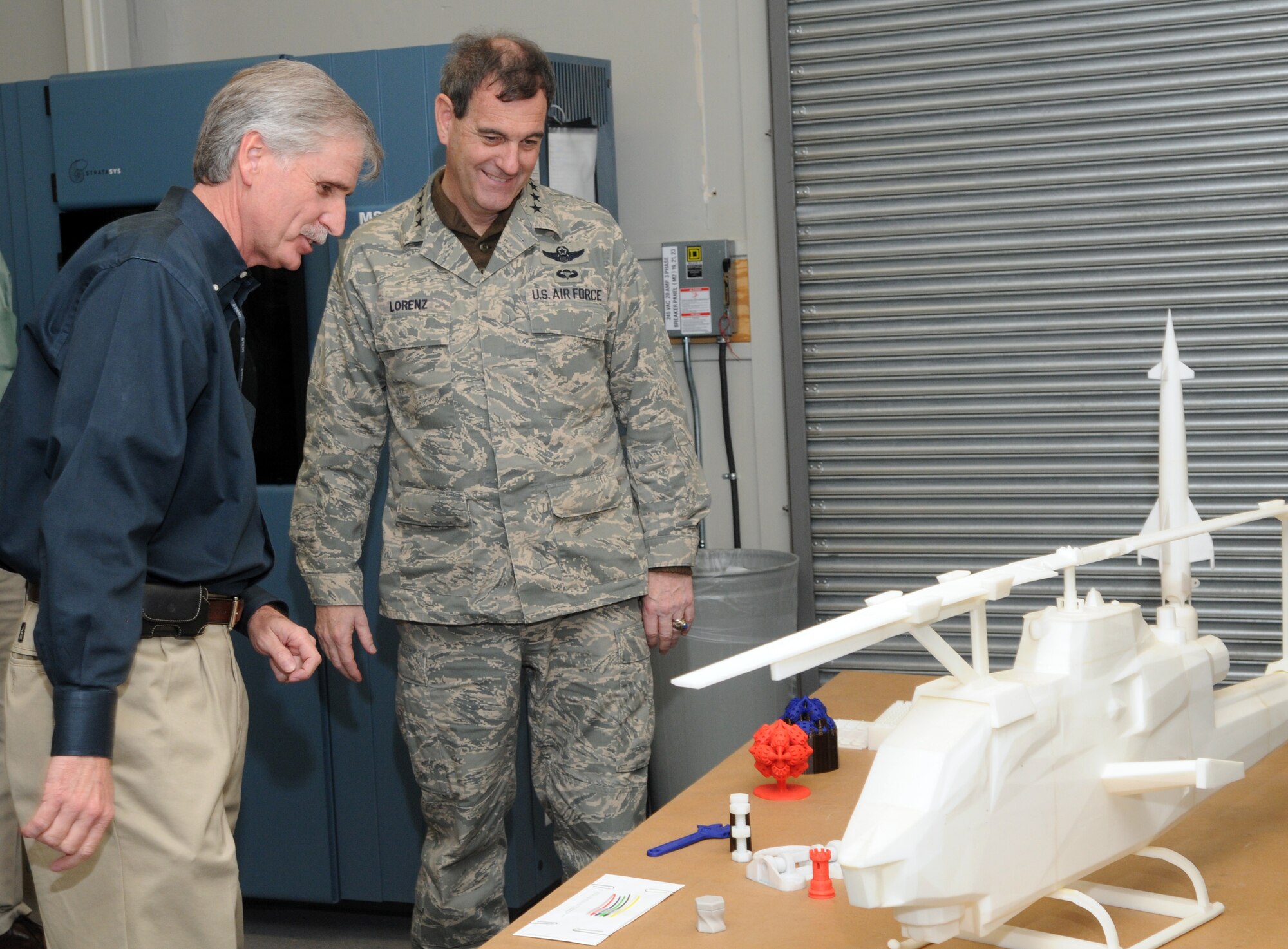 Kevin Haley, 12th Mission Support Group Trainer Development Division, explains some models of aircraft to Gen. Stephen Lorenz, Air Education and Training Command commander, during his visit to the wing last week. General Lorenz visited the wing March 11-13 to learn about the mission and people who both work for and support the needs of the major command. (U.S. Air Force photo by Joel Martinez)