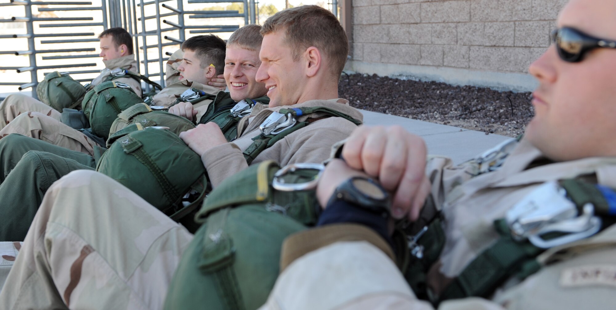 NELLIS AIR FORCE BASE, Nev., -- Jump-qualified Airmen participating in Red Flag 09-3 at Nellis Air Force Base, Nev., relax before participating in a Survival, Evasion, Resistance and Escape, or SERE, static line jump March 5. SERE specialists prepare aircrews and other high-risk personnel to survive under any conditions. Red Flag, which concluded March 13, featured more than 90 aircraft, 2,000 personnel and 27 units from the United States military and its allies. (U.S. Air Force photo by Airman 1st Class Debbie Lockhart)