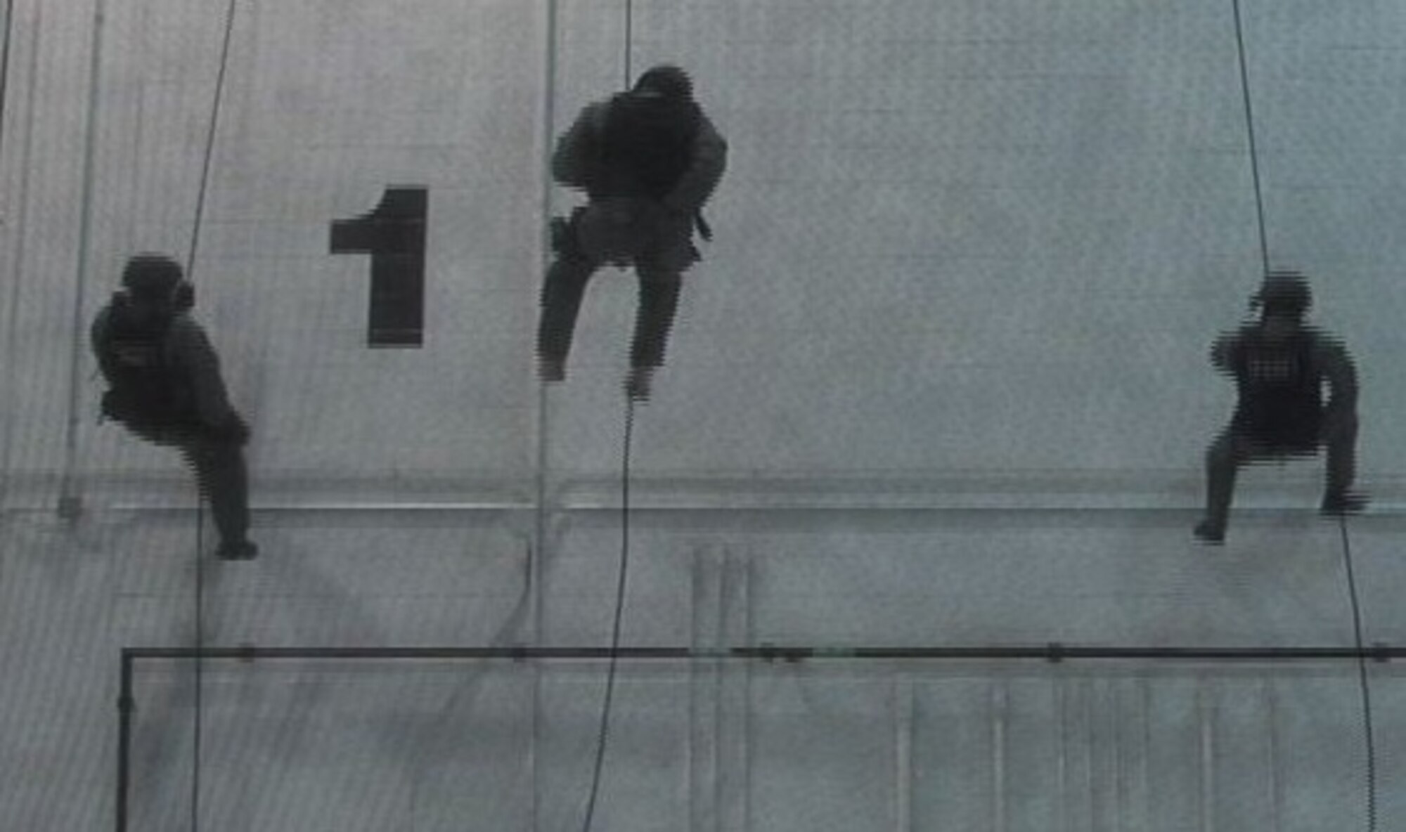 MCCONNELL AIR FORCE BASE, Kan. -- Team McConnell Emergency Services members repel down a wall during training, Feb. 1. Repelling is a maneuver used by the team to reach difficult locations quickly. Repelling into a situation can also afford them the element of surprise.  (Photo by Senior Airman Nicholas Stowers)