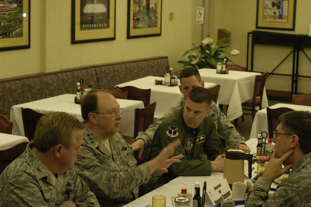 Lt. Gen. Charles E. Stenner Jr., Chief of Air Force Reserve, Headquarters U.S. Air Force, Washington, D.C., and Commander, Air Force Reserve Command, Robins Air Force Base, Ga., has an after breakfast discussion with the 911th Airlift Wing commander, Col. Gordon H. Elwell, Jr. (right), and the Wing's group commanders during the general's first visit to the Pittsburgh base, March 8, 2009. (U.S. Air Force photo by Staff Sgt. Daniel Irwin).