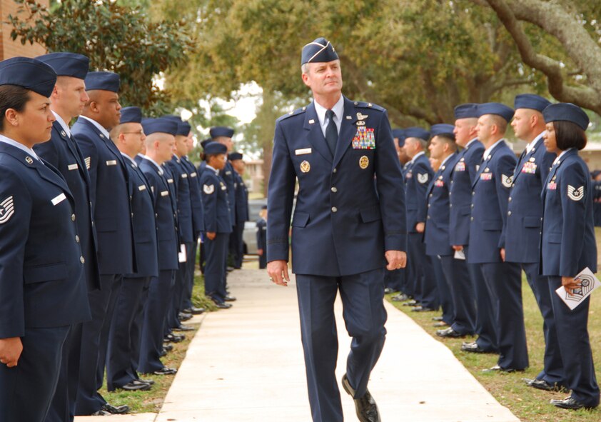 Brig. Gen. Darryl Roberson, 325th Fighter Wing commander, makes his way to the entrance of the Tyndall Air Force Base Chapel March 16 where a memorial service for the first Chief Master Sgt. of the Air Force, Paul W. Airey, was held. He is flanked on either side by formations of Airmen from the Tyndall Paul W. Airey NCO Academy. Chief Airey spent 27 years in the U.S. Air Force, obtaining the rank of Chief Master Sgt. of the Air Force April 3, 1967. He retired Aug. 1, 1970 and died March 11, 2009. He was 85 years old. (U.S. Air Force photo/Susan Trahan)