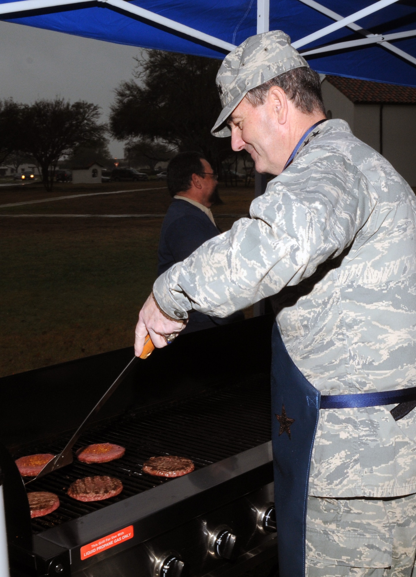 Gen. Stephen Lorenz, Air Education and Training Command commander, took time out of his visit last week to flip some burgers in support of the Air Force Assistance Fund kickoff. General Lorenz visited the wing March 12-13 to learn about the mission and people who both work for and support the needs of the major command. (U.S. Air Force photo by Joel Martinez)